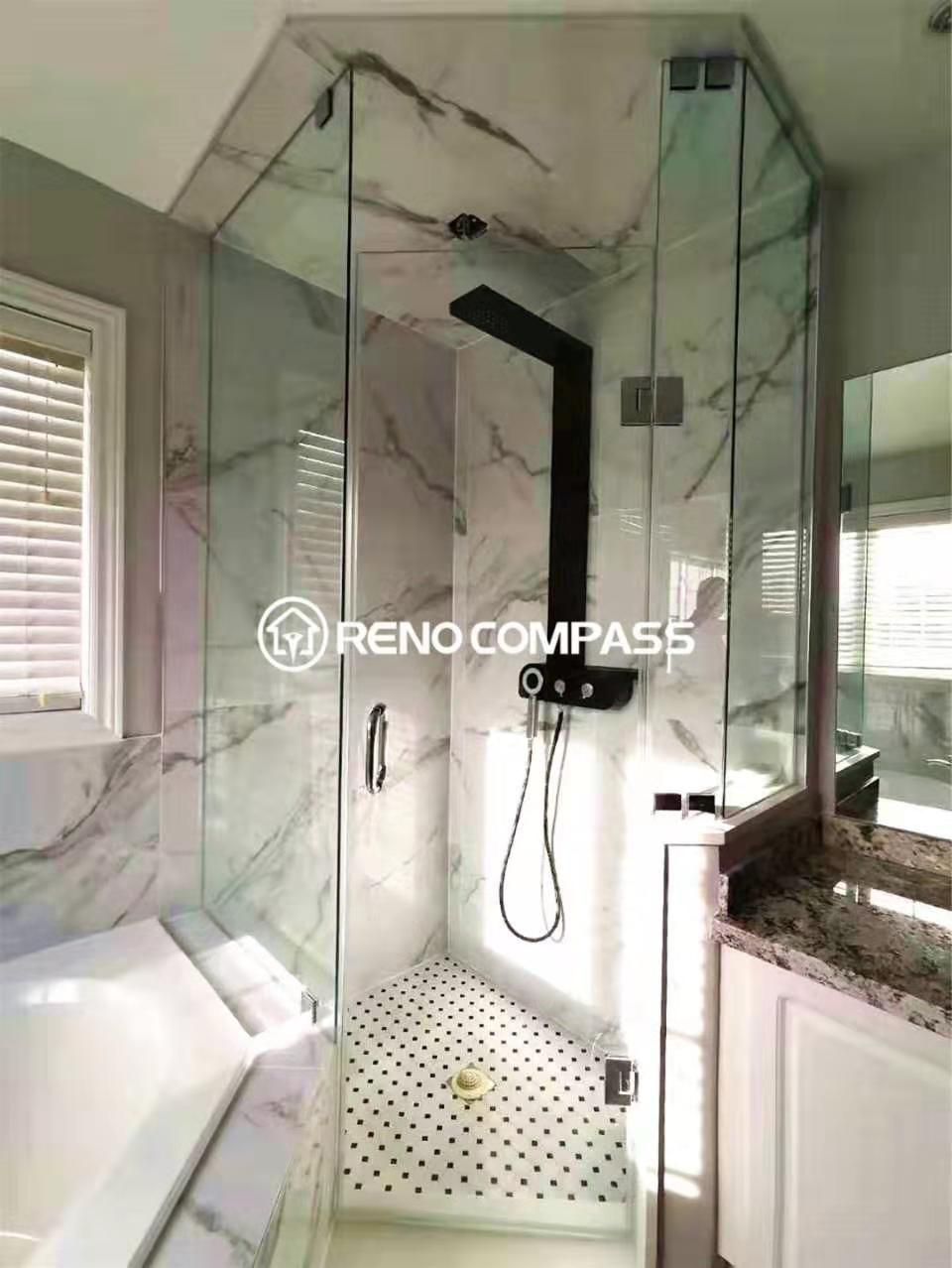 Modern bathroom renovation in Woodbridge featuring a custom glass-enclosed shower, marble-style wall tiles, and matte black shower fixtures. Completed by a professional Toronto renovation company, this upgrade enhances both functionality and visual appeal with improved layout, lighting, and waterproof finishes.