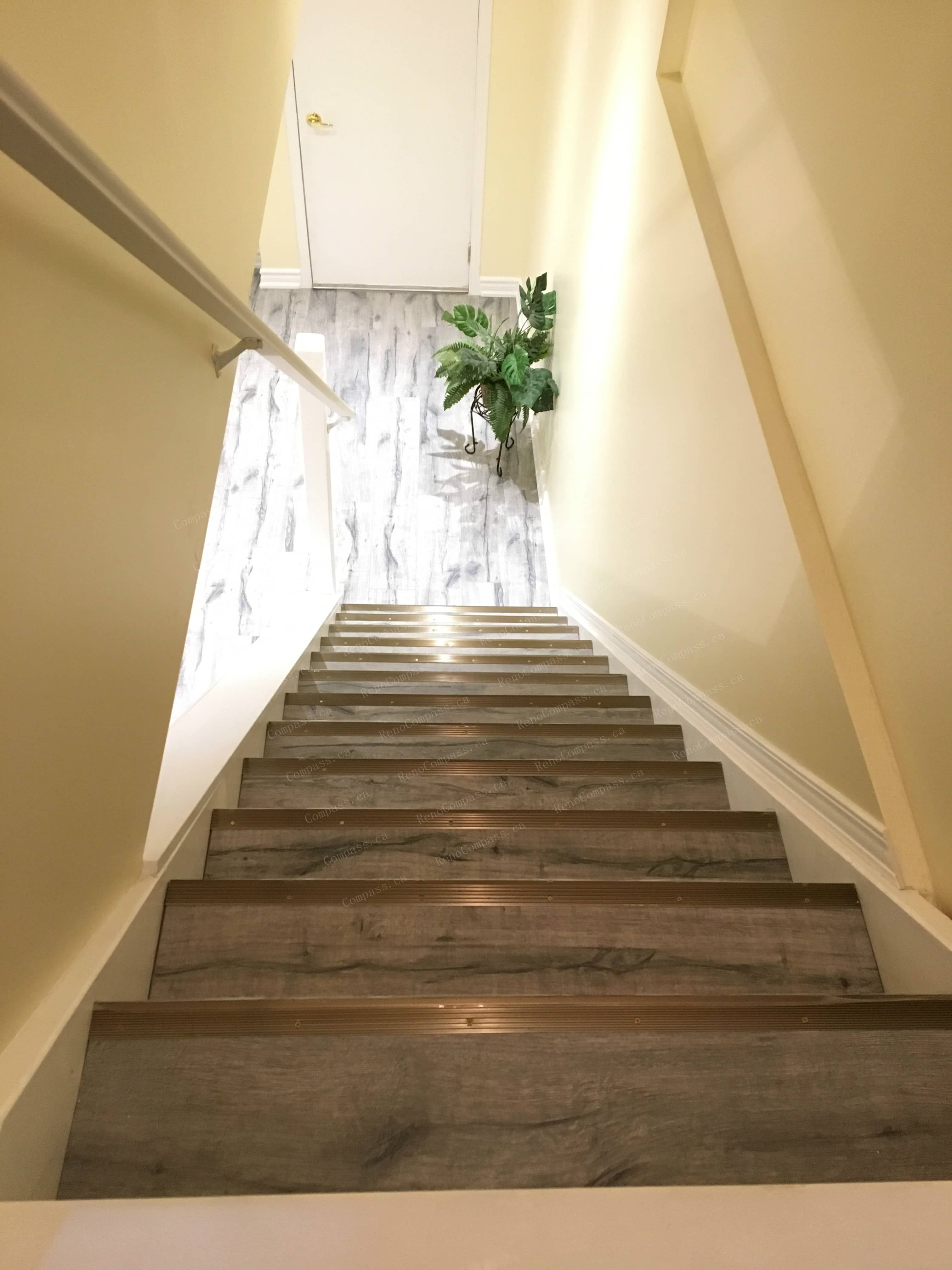 This Mississauga basement renovation includes a fully upgraded staircase with modern wood steps and clean side railings, creating a smooth transition from the main floor to the finished basement. Completed by a reliable Toronto renovation company, the staircase design enhances safety, durability, and visual continuity, complementing the one-bedroom, one-bathroom basement layout with a bright and cohesive finish.