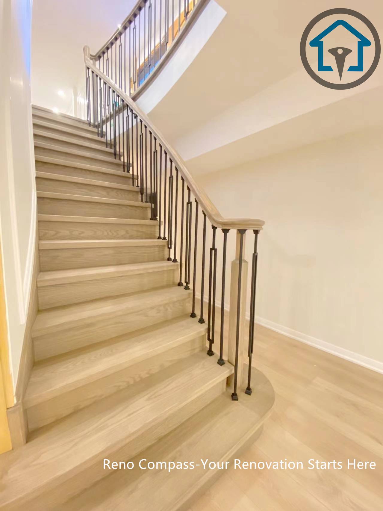 This image showcases the renovated staircase in a North York house, featuring light-toned wood steps paired with custom black metal balusters. The redesign improves safety, visual continuity, and flow between floors, while enhancing the overall brightness and architectural character of the home.