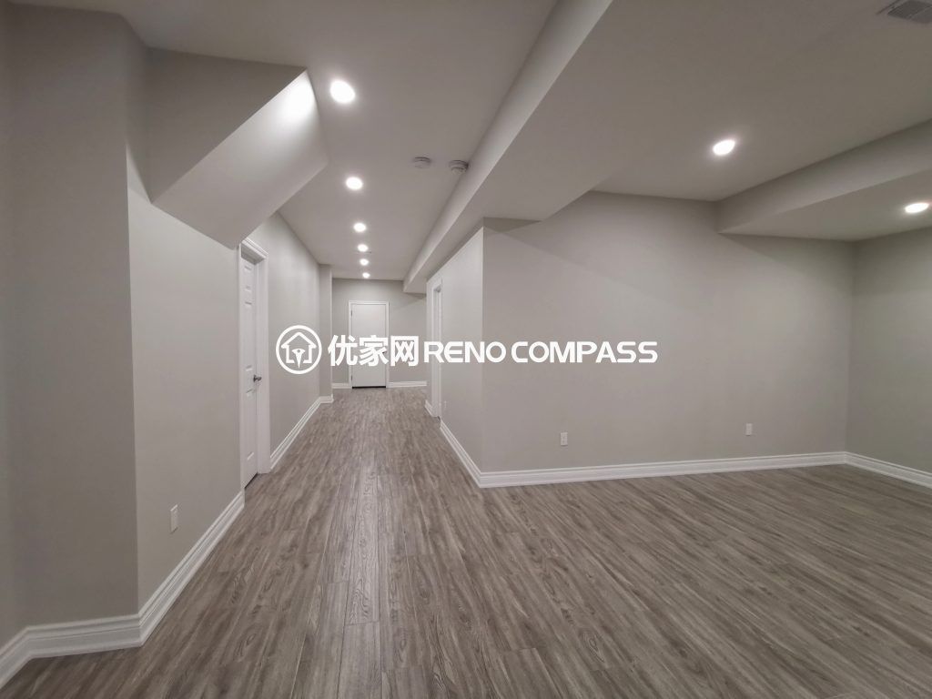 This Vaughan basement renovation features a fully finished open-concept layout designed for flexibility and modern living. The space includes new durable flooring, smooth ceiling finishing with pot lights, and clean structural column integration to create a bright and functional environment. Completed by a trusted Toronto renovation company, this basement transformation enhances usable living space while adding long-term comfort, value, and contemporary style to the home.