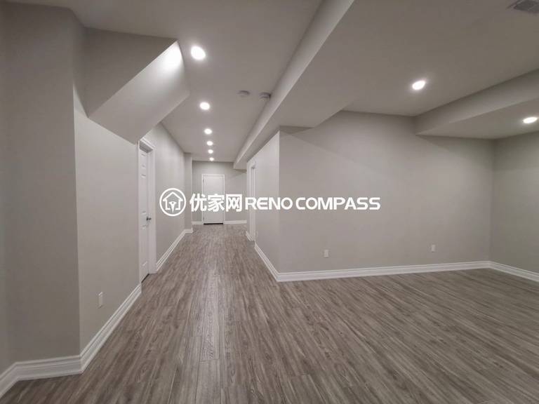 This Vaughan basement renovation features a fully finished open-concept layout designed for flexibility and modern living. The space includes new durable flooring, smooth ceiling finishing with pot lights, and clean structural column integration to create a bright and functional environment. Completed by a trusted Toronto renovation company, this basement transformation enhances usable living space while adding long-term comfort, value, and contemporary style to the home.