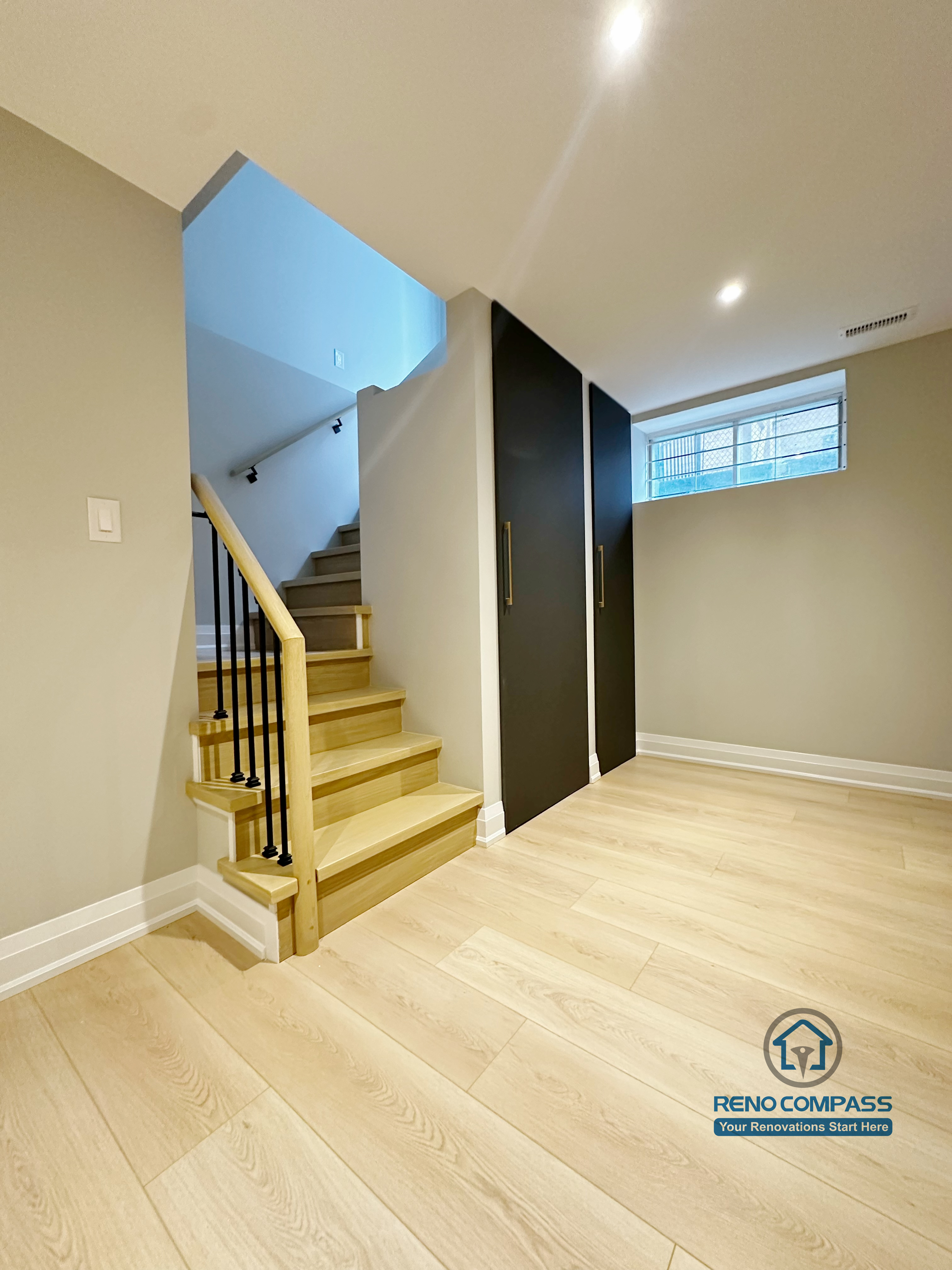 Basement renovation in Richmond Hill featuring a clean staircase design, light wood steps, modern railing, and smooth access layout connecting the basement to the main level.