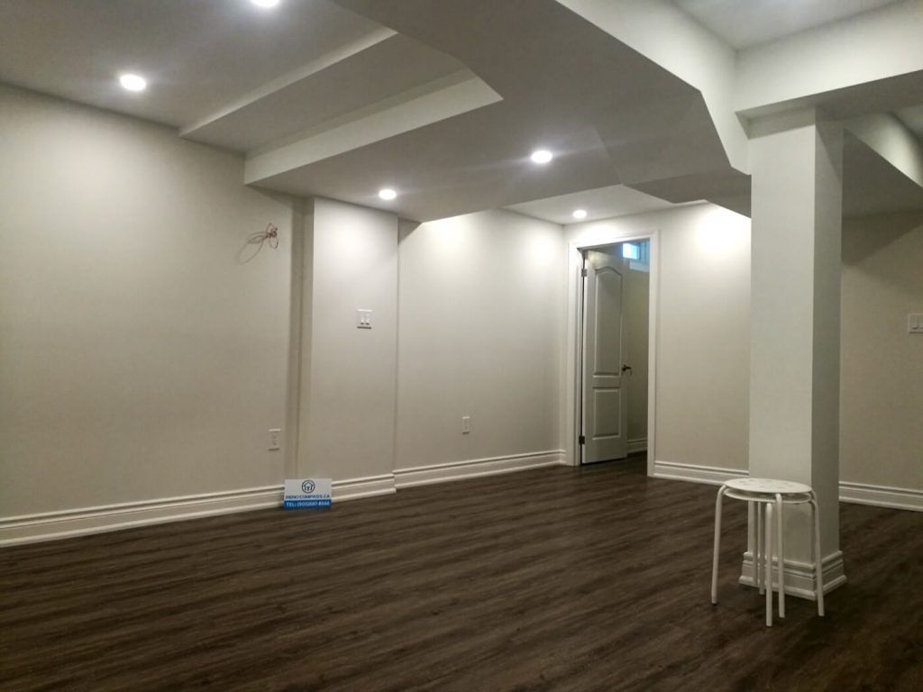 This finished basement renovation in Markham showcases a spacious open-concept layout designed for flexibility and everyday comfort. The renovation features high-quality vinyl flooring, modern recessed lighting, structural column refinishing, and a bright neutral color palette that enhances the sense of space. A newly upgraded basement bathroom and multiple storage areas improve functionality, creating a versatile lower level suitable for family living, recreation, or guest use. Completed by a trusted Toronto renovation company, this project highlights practical design and clean craftsmanship for modern homes.