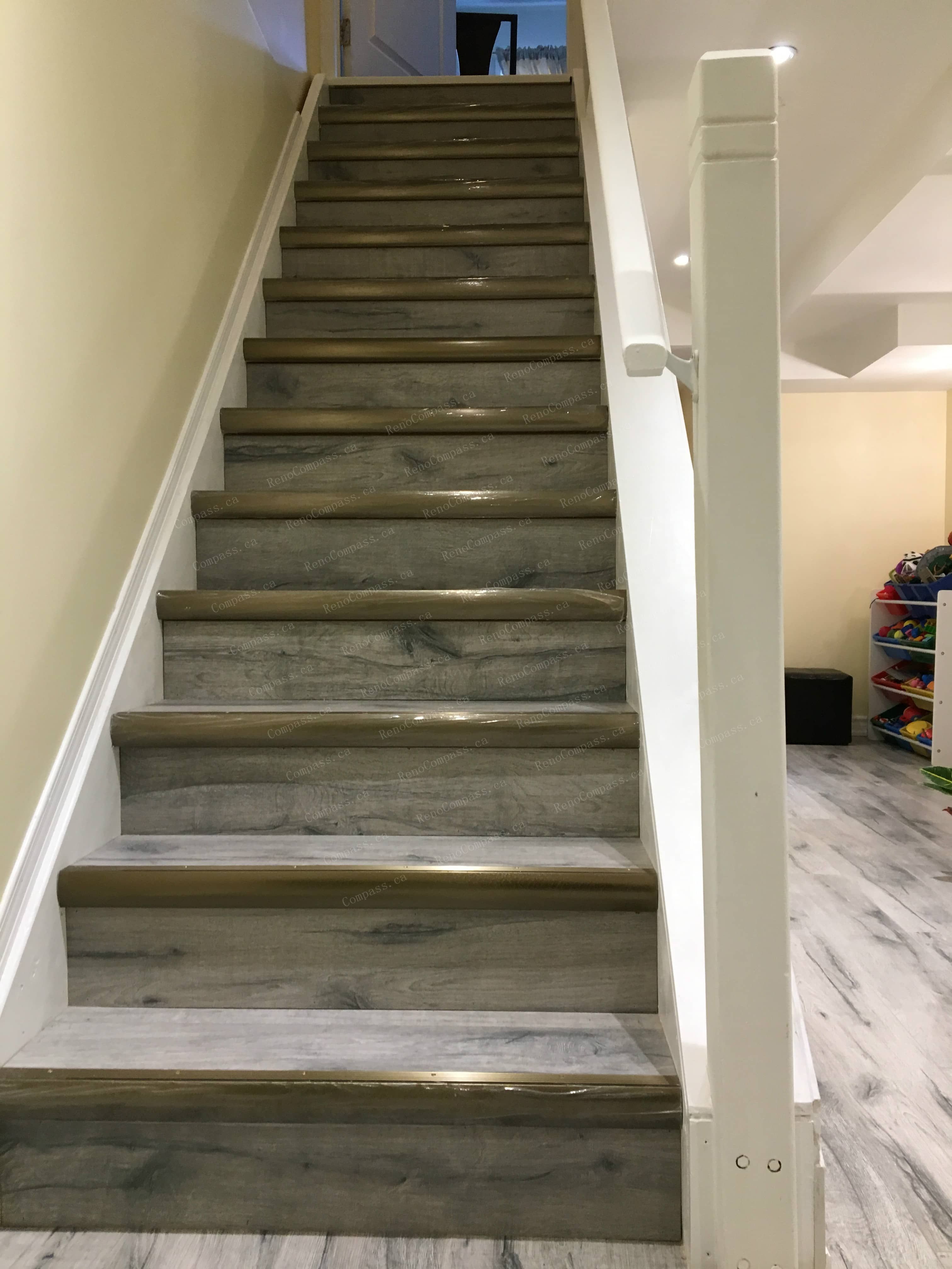 This Mississauga basement renovation includes a fully upgraded staircase with modern wood steps and clean side railings, creating a smooth transition from the main floor to the finished basement. Completed by a reliable Toronto renovation company, the staircase design enhances safety, durability, and visual continuity, complementing the one-bedroom, one-bathroom basement layout with a bright and cohesive finish.