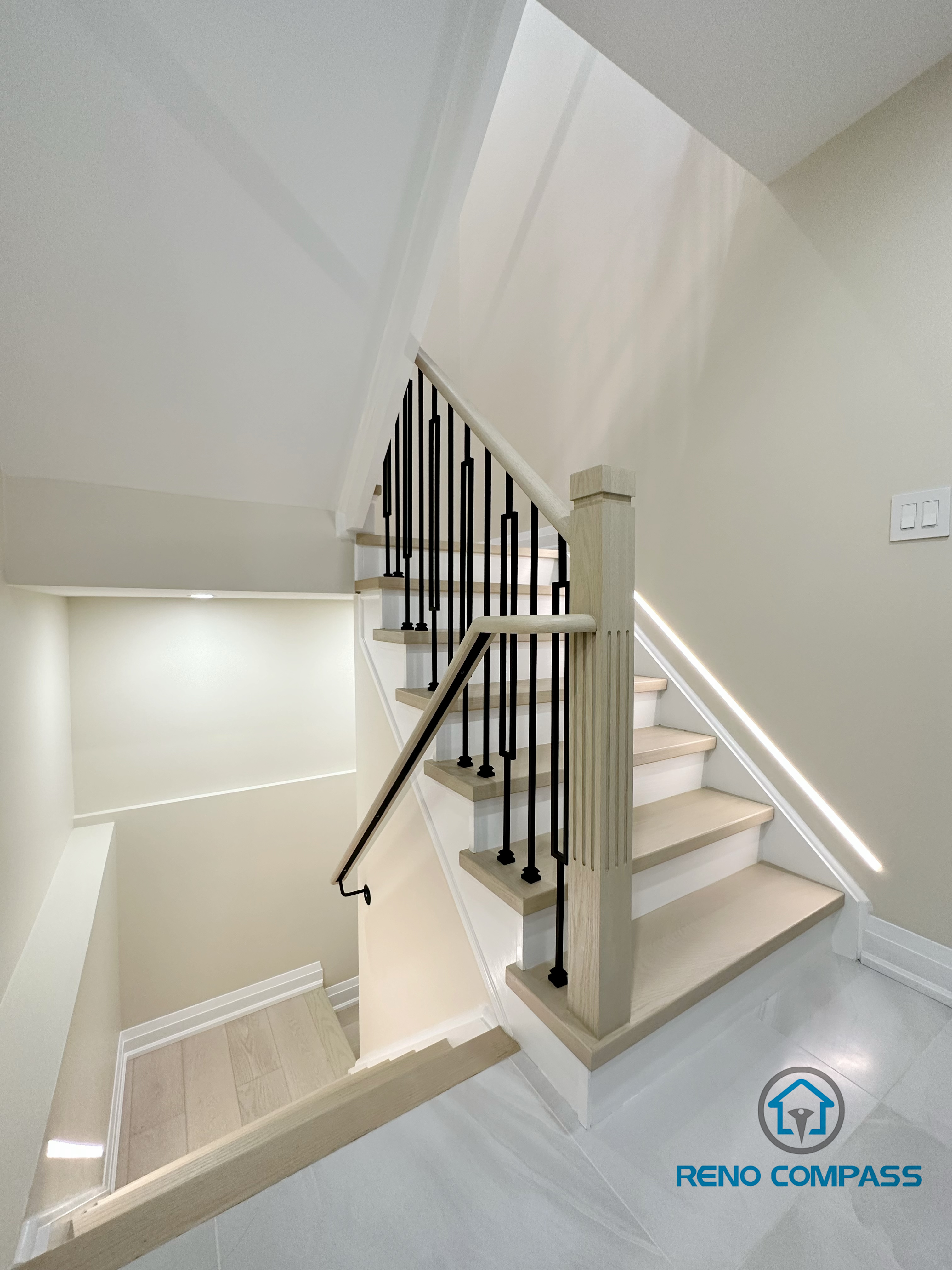 This image showcases our completed light wood staircase renovation in Vaughan. Featuring natural pale wood treads and minimalist metal railings, this design creates a warm, bright, and airy modern feel for the home. We specialize in custom interior renovations across the Greater Toronto and Vaughan area.
