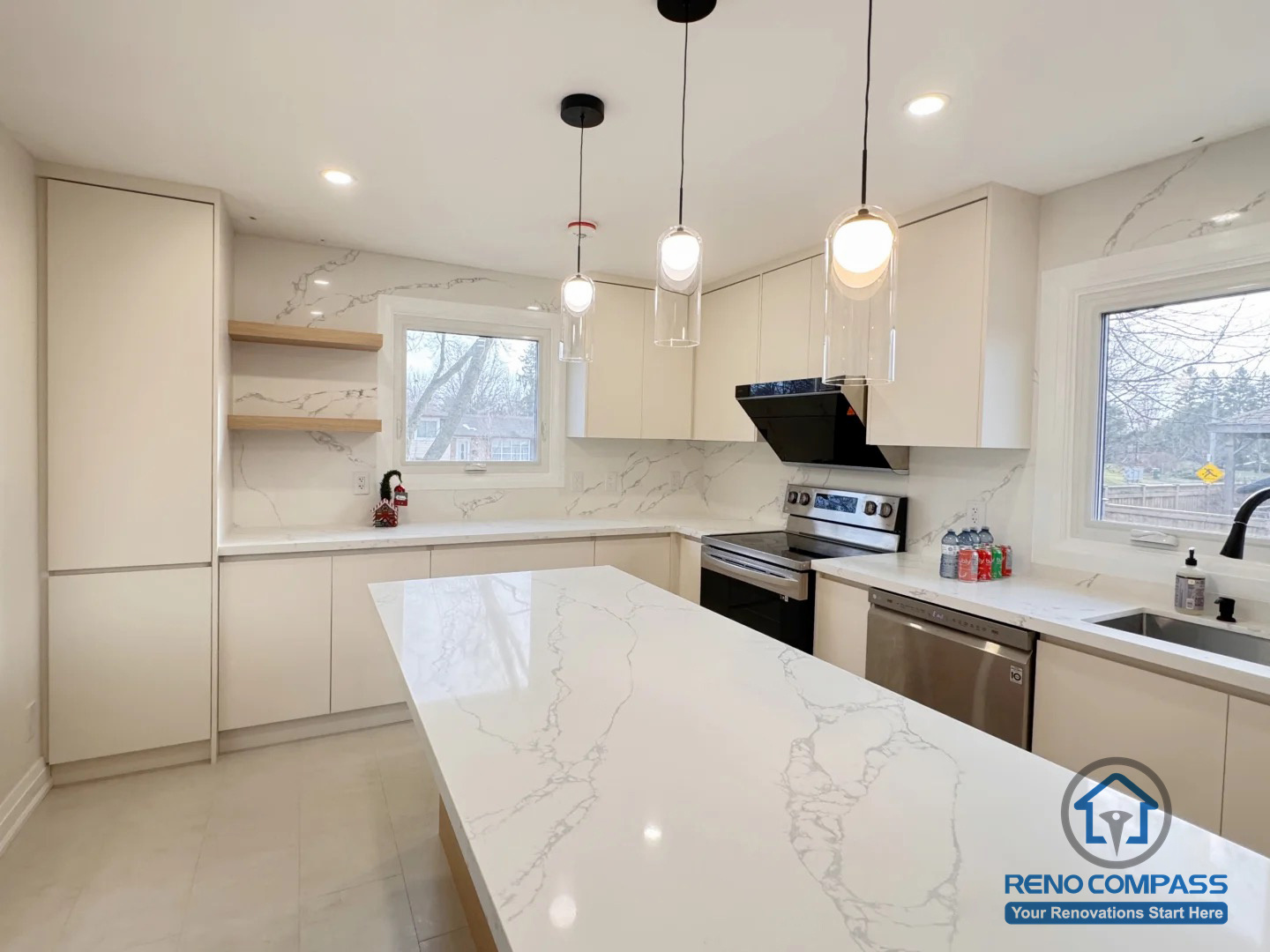 This Oakville interior renovation features a modern kitchen centered around a functional island that enhances both workflow and visual balance. Clean cabinetry, quartz countertops, and soft pendant lighting work together to create a bright, open, and well-organized space. The layout maximizes natural light and provides a seamless connection between cooking, preparation, and everyday use.