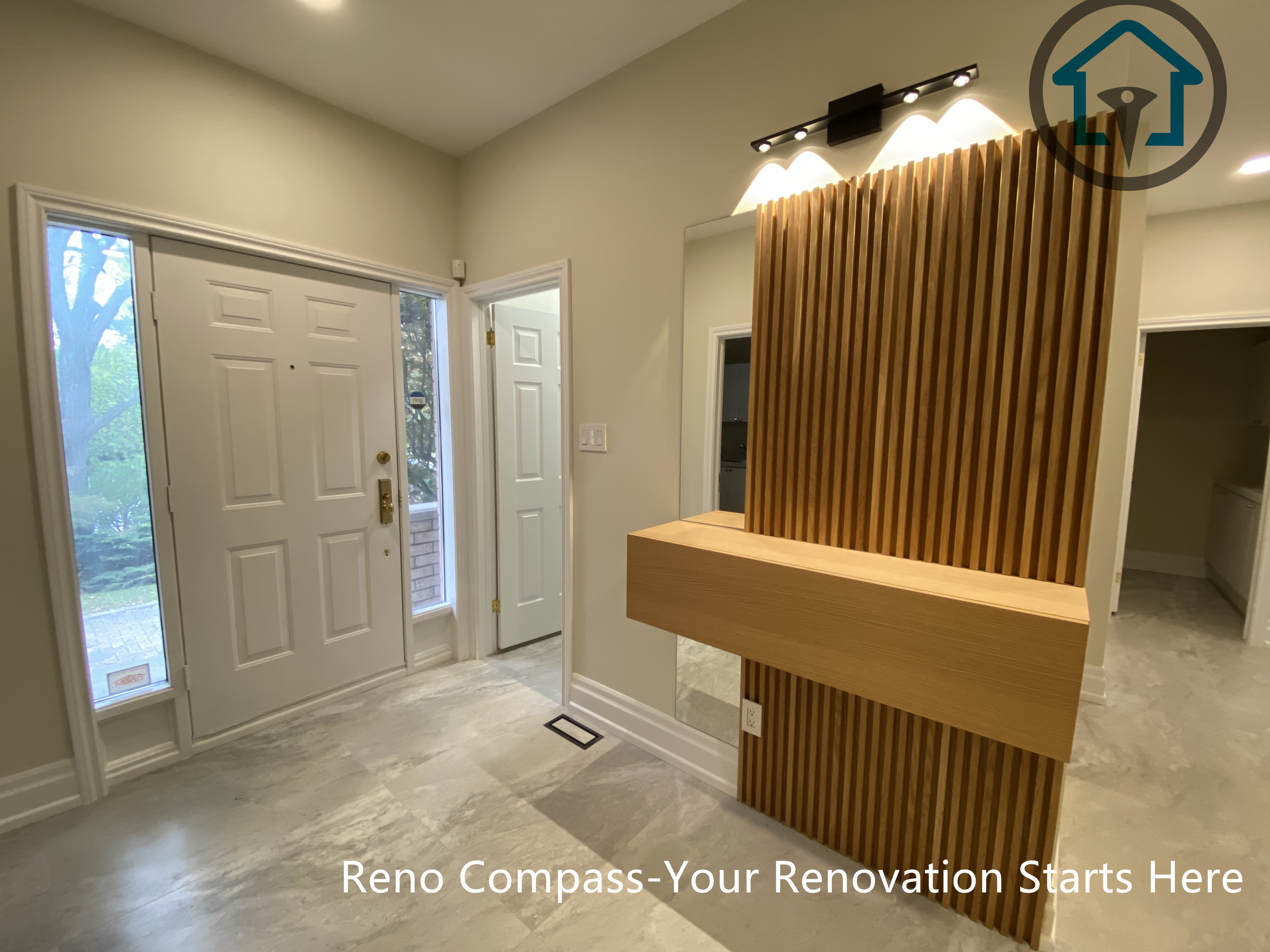 Custom wood slat feature wall designed for a modern Thornhill entryway renovation by Reno Compass.