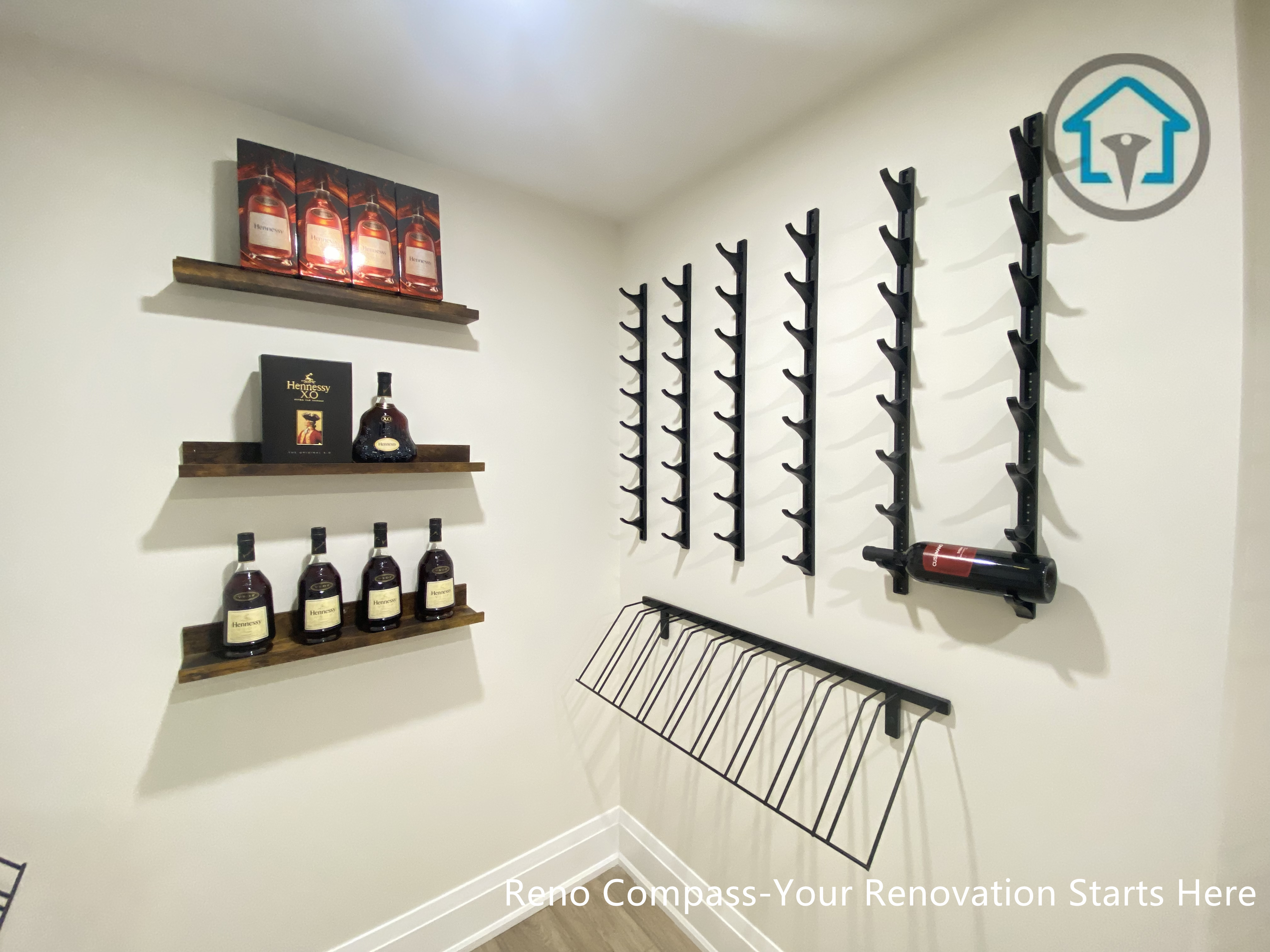 This image features a custom-designed wine cellar within a Richmond Hill interior renovation, showcasing symmetrical wall-mounted wine racks and a clean, gallery-style layout. The narrow corridor design maximizes bottle storage while maintaining visual order and ease of access. Neutral finishes and wood flooring add warmth and balance to the space. Designed and completed by Reno Compass, this wine storage solution reflects a refined approach to functional interior design for homes in Richmond Hill.