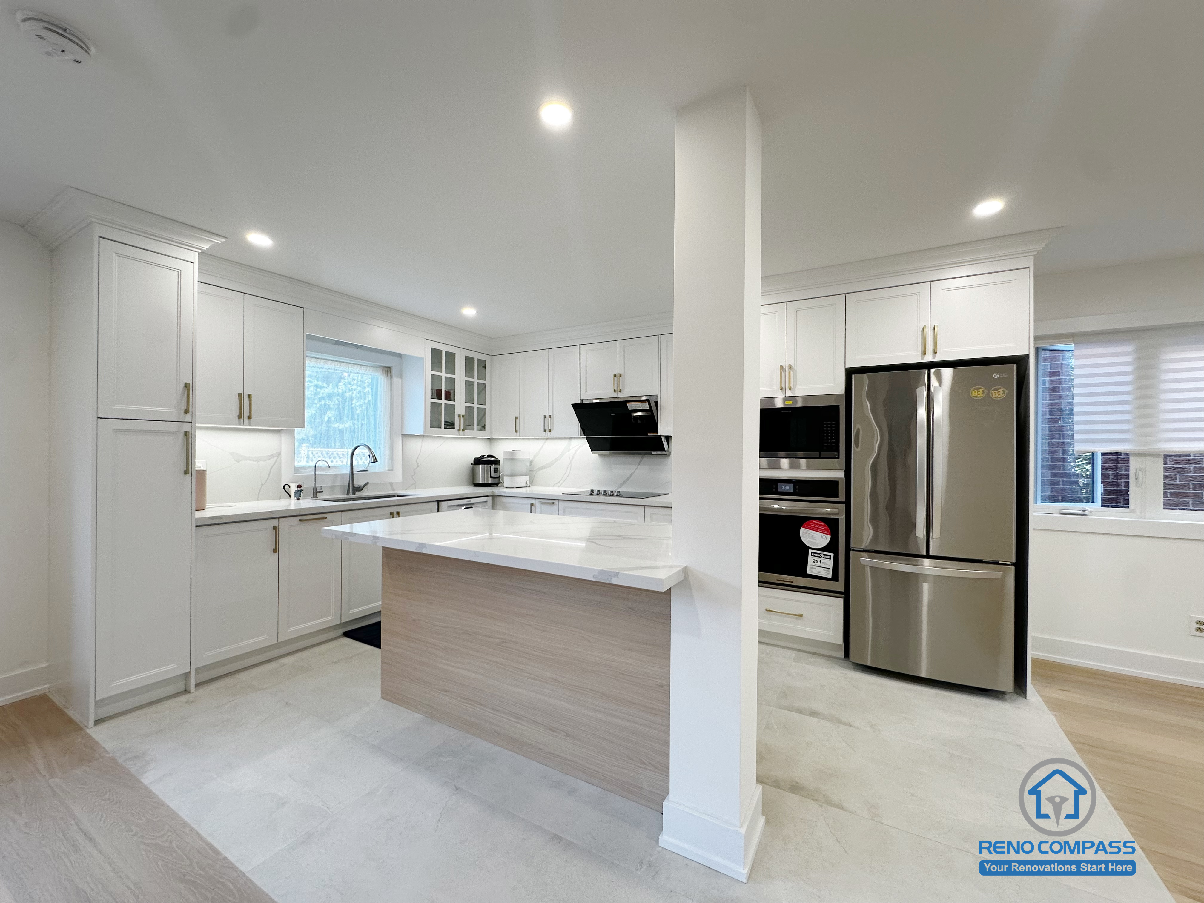 This Richmond Hill interior renovation features an open-concept kitchen designed around a central island that enhances both functionality and flow. Custom white cabinetry, integrated stainless steel appliances, and clean-lined finishes create a bright and cohesive cooking space. The island serves as a visual anchor while supporting daily use, casual dining, and family interaction. Completed as part of a Toronto renovation project focused on efficiency, modern layout planning, and long-term everyday comfort.