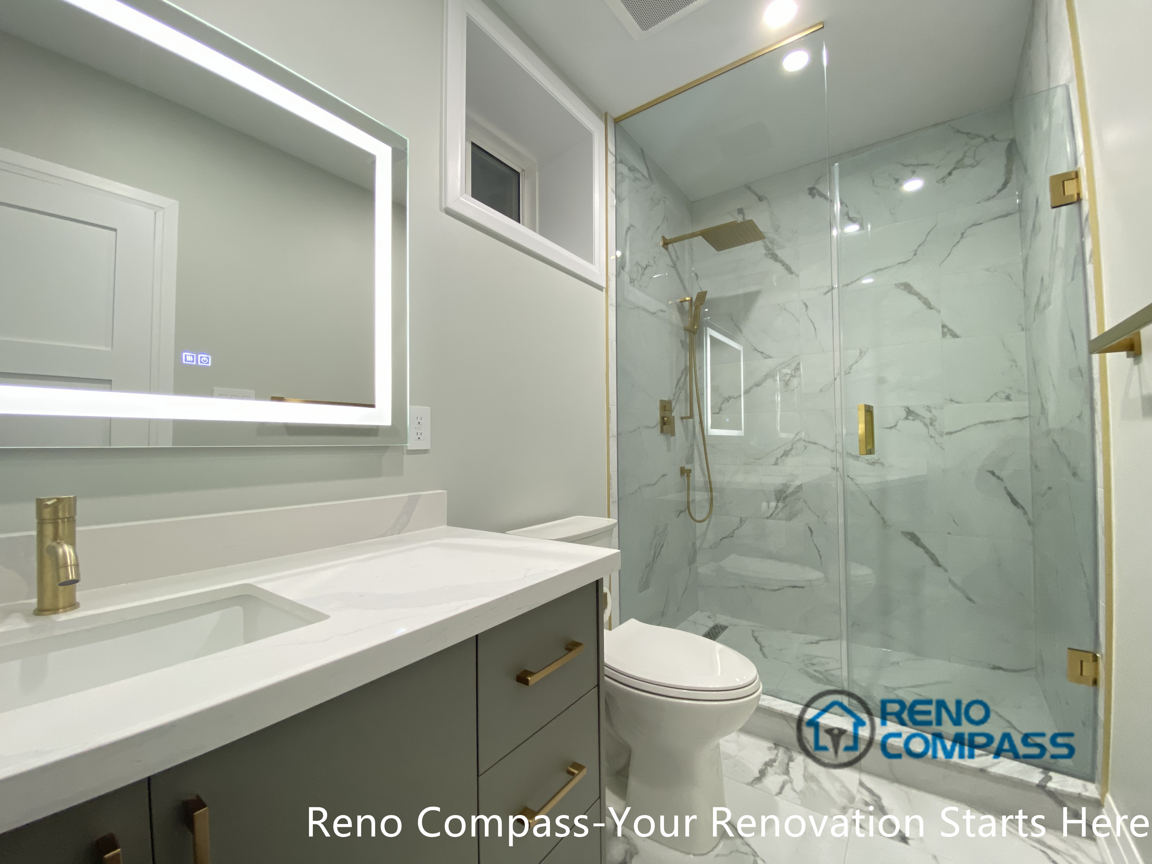 This Newmarket basement bathroom renovation features a modern walk-in glass shower with marble-look porcelain tiles, brushed gold fixtures, and a custom vanity with an LED backlit mirror. Designed and built by a professional Toronto renovation company, the space maximizes brightness, functionality, and visual cleanliness, creating a comfortable and elegant basement bathroom suitable for daily use or guest accommodation.