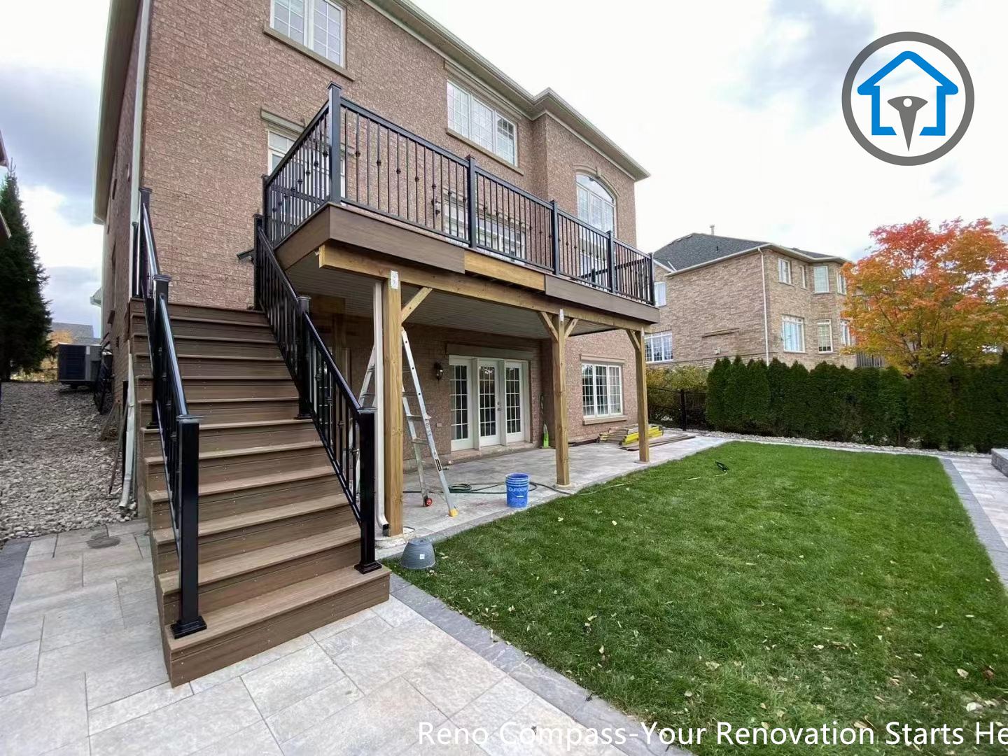 This image showcases a residential interlocking walkway and patio paving project in Oakville. The stone pattern creates a smooth transition between driveway, entrance, and outdoor living areas, improving both functionality and aesthetics. A professional paving solution completed by Reno Compass Inc.