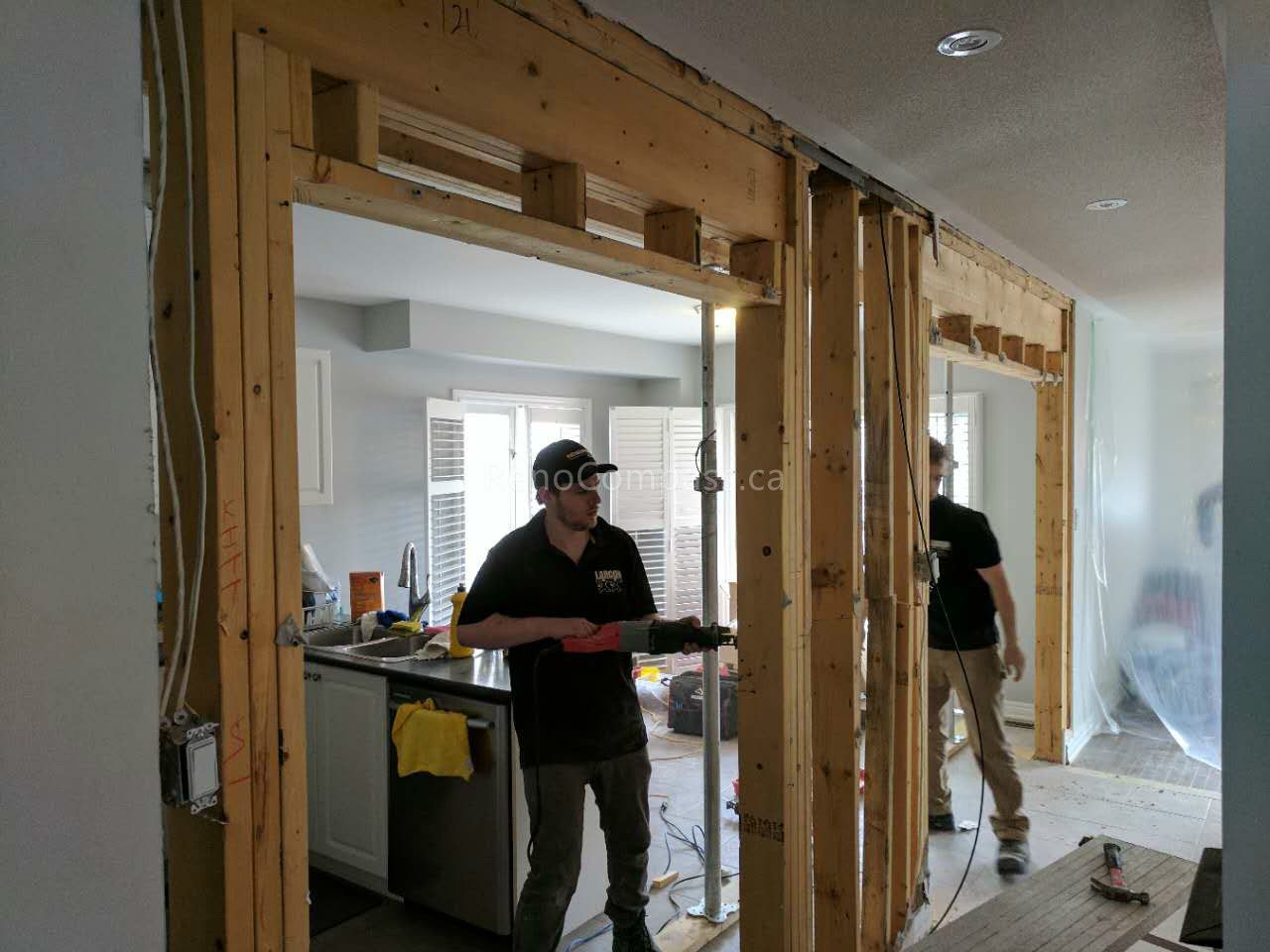 This Vaughan kitchen renovation showcases the remodeling process during construction, including structural opening expansion and layout reconfiguration to create a more open-concept kitchen. Reno Compass Inc. redesigned the space to improve flow, lighting, and functionality, preparing for new cabinetry, countertops, and modern finishes. Professional demolition and framing work ensure a strong foundation for a stylish and efficient kitchen transformation.