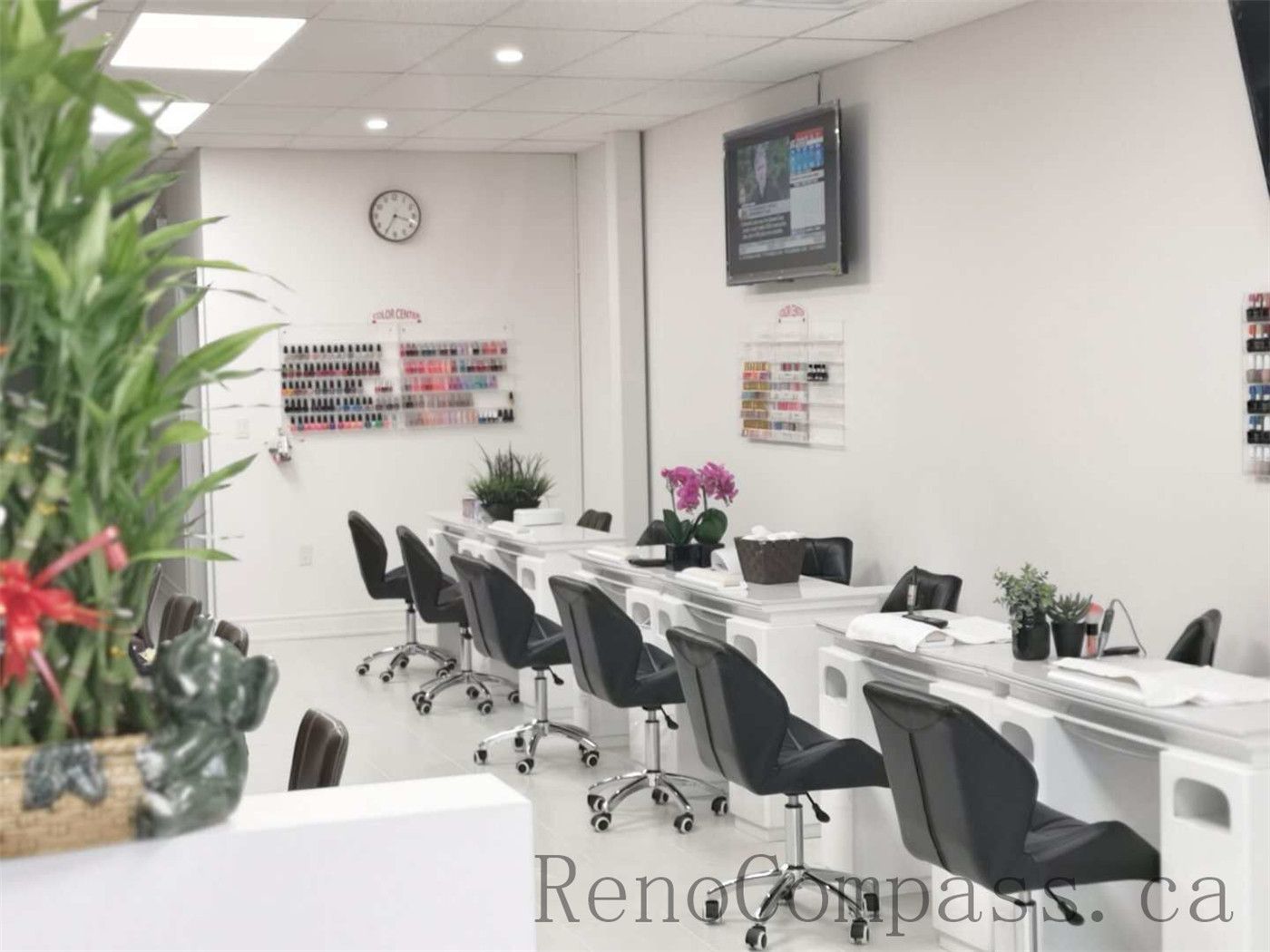Bright and modern Toronto nail spa commercial renovation featuring clean white manicure stations, ergonomic salon chairs, and a spacious open layout. This professional beauty salon interior upgrade focuses on hygiene, lighting, and efficient workstation design to enhance both customer experience and staff workflow. Commercial nail salon renovation completed by Reno Compass Inc., a reliable Toronto renovation company specializing in retail and beauty spaces.