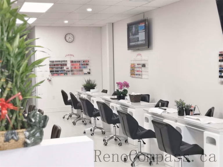 Bright and modern Toronto nail spa commercial renovation featuring clean white manicure stations, ergonomic salon chairs, and a spacious open layout. This professional beauty salon interior upgrade focuses on hygiene, lighting, and efficient workstation design to enhance both customer experience and staff workflow. Commercial nail salon renovation completed by Reno Compass Inc., a reliable Toronto renovation company specializing in retail and beauty spaces.