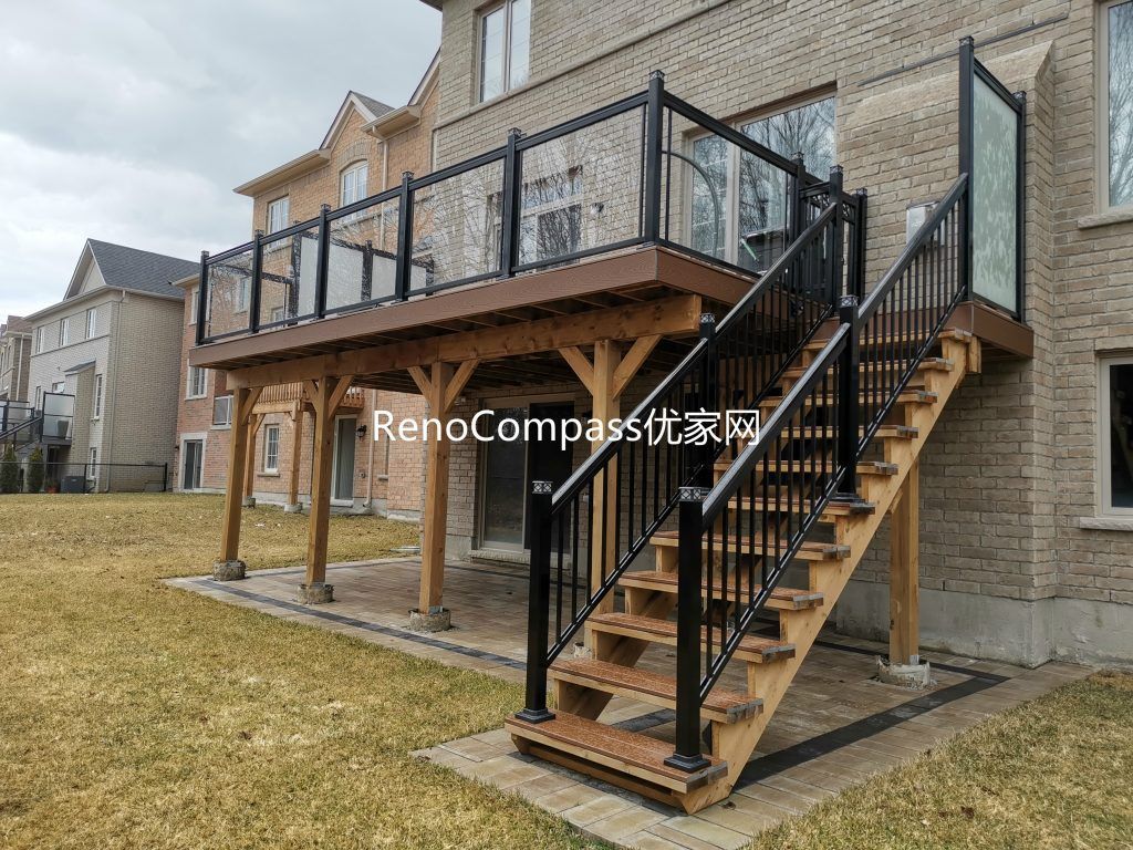 Custom backyard renovation in Aurora featuring solid wood deck stairs, modern railing installation, and professionally installed interlocking patio flooring. This outdoor upgrade enhances accessibility, durability, and overall backyard functionality while creating a clean and stylish landscape design.
