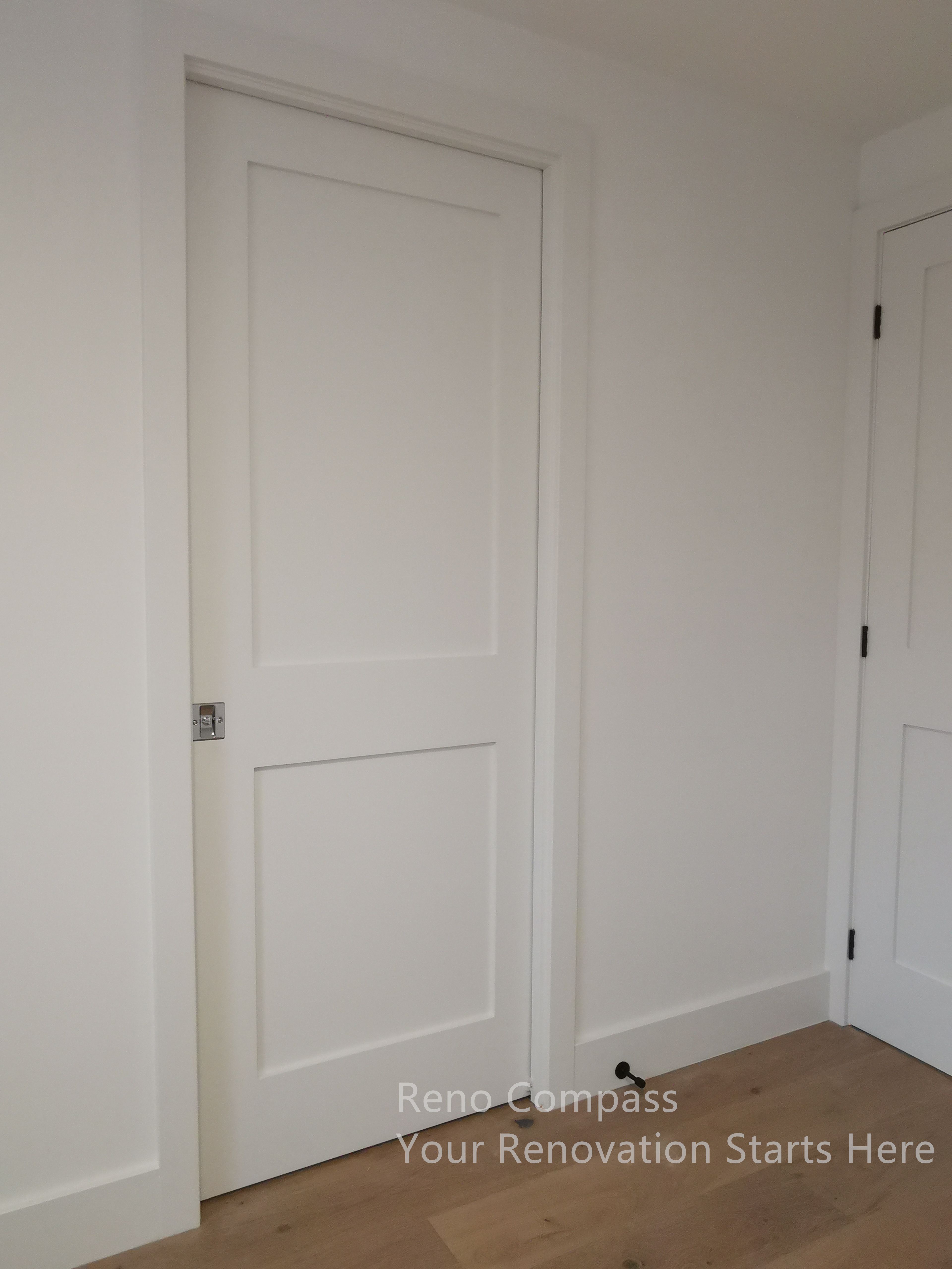 This image highlights a modern interior door installation completed as part of a Markham interior renovation. The clean-lined white door is paired with minimal trim and precise detailing, creating a seamless transition between spaces. Consistent finishes and careful alignment contribute to a cohesive interior aesthetic, enhancing both visual clarity and long-term durability throughout the home.