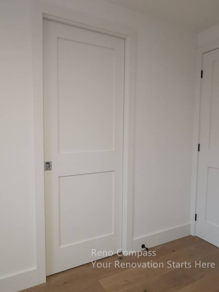 This image highlights a modern interior door installation completed as part of a Markham interior renovation. The clean-lined white door is paired with minimal trim and precise detailing, creating a seamless transition between spaces. Consistent finishes and careful alignment contribute to a cohesive interior aesthetic, enhancing both visual clarity and long-term durability throughout the home.