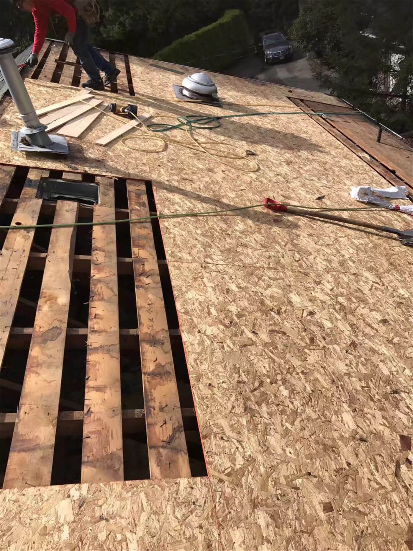 Roof replacement project in Toronto showing the complete removal of the old roofing system and exposed roof deck for structural inspection. Damaged sections were identified and prepared for plywood replacement to ensure a solid and level base for the new roofing materials. Proper deck inspection and repair are critical steps in extending roof lifespan and preventing future leaks.
Completed by an experienced Toronto roofing contractor following safety and building code requirements.