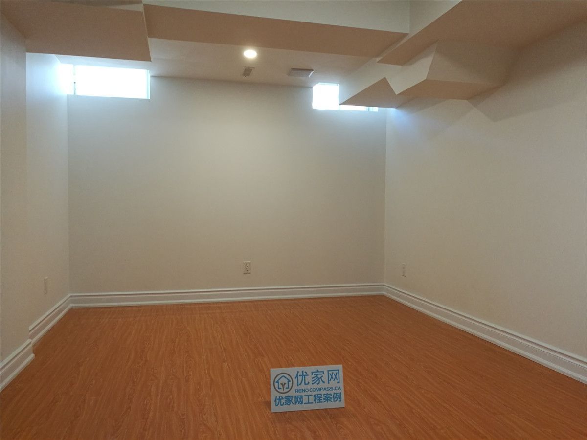 This completed basement space highlights a clean and versatile room designed as part of a Vaughan basement renovation project. Featuring warm-toned hardwood flooring, smooth painted walls, recessed ceiling lighting, and well-positioned basement windows for natural light, the room creates a bright and comfortable environment suitable for a bedroom, home office, or entertainment area.

Careful attention was given to ceiling bulkhead integration and trim detailing to ensure a seamless and polished finish. Completed by a trusted Toronto Renovation Company, this basement upgrade combines functionality, durability, and refined craftsmanship to enhance both living space and property value.