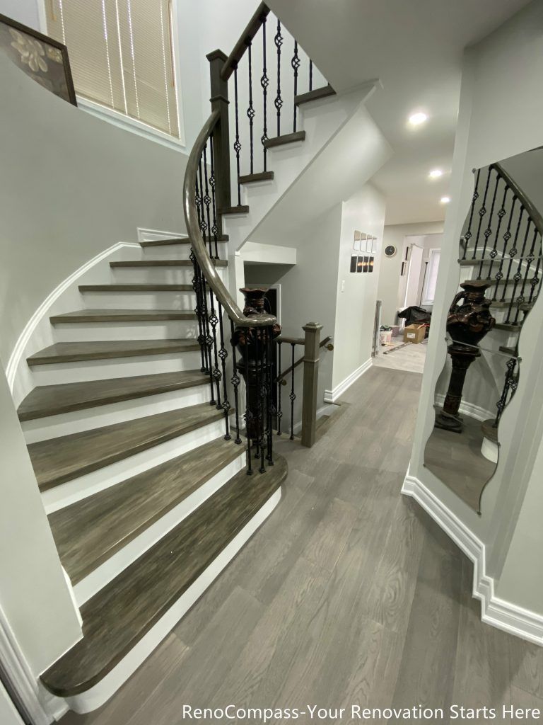 This Mississauga interior renovation features a beautifully upgraded curved staircase with custom wood steps, modern iron railings, and contemporary flooring throughout the main level. The redesign enhances the home’s entrance with improved lighting, clean wall finishes, and seamless transitions between spaces. Completed by a professional Toronto renovation company, this renovation focuses on craftsmanship, durability, and modern aesthetics, creating a bright and elegant interior that increases both functionality and long-term property value.