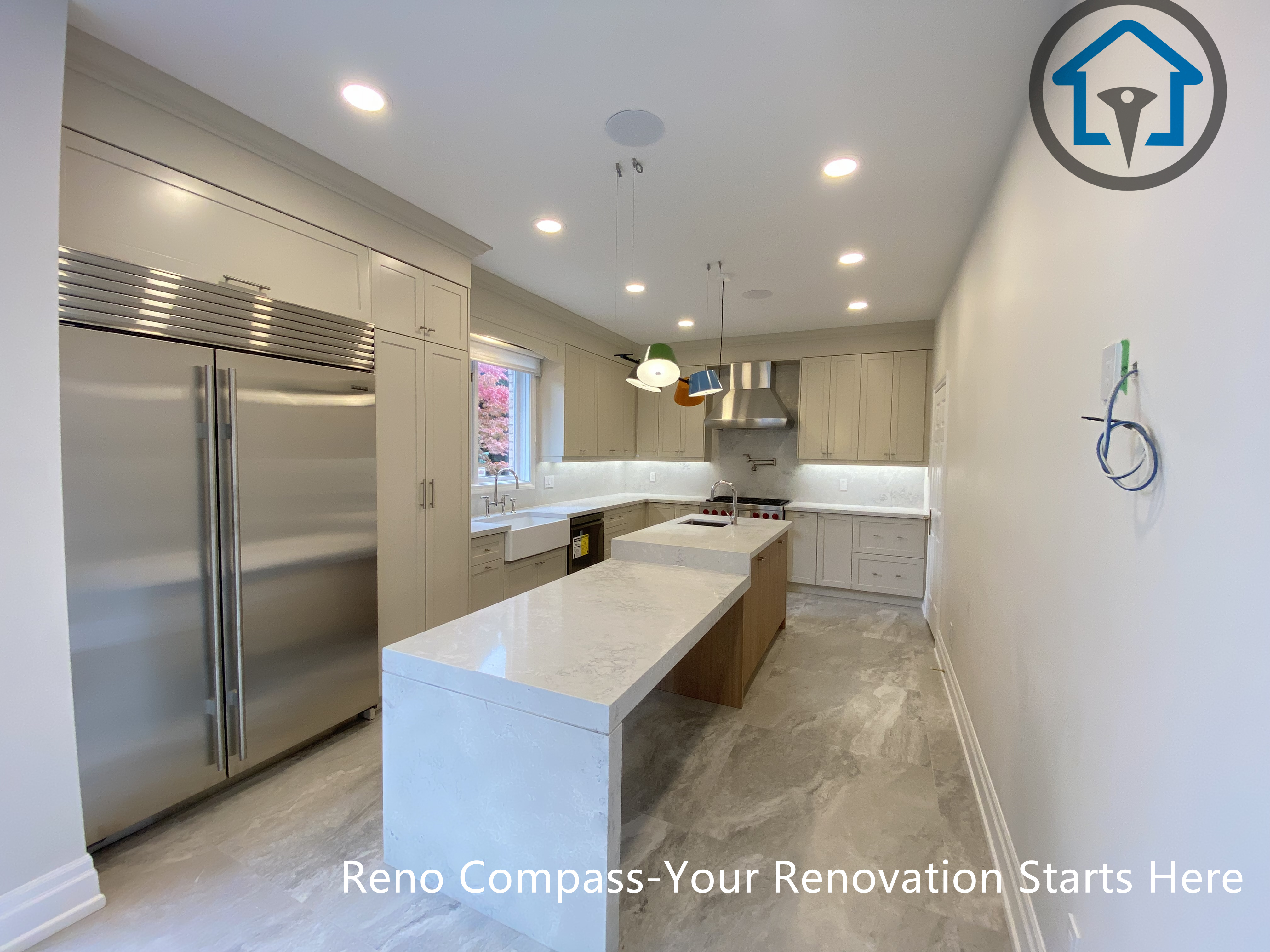 Modern kitchen with waterfall island and custom cabinetry, completed as part of a Thornhill renovation by Reno Compass.