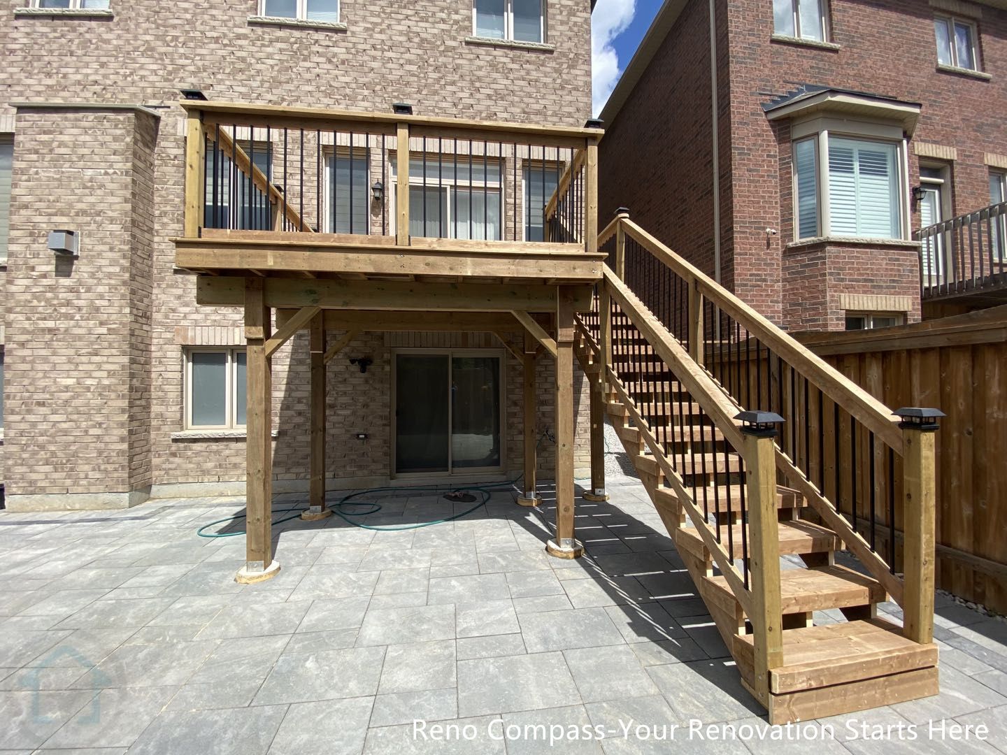 This Markham outdoor renovation features a spacious interlocking stone patio paired with a custom-built raised wooden deck and staircase. Large-format patio stones were installed with precise alignment to create a durable, low-maintenance surface suitable for outdoor seating and everyday use. The elevated deck provides direct access from the home while enhancing the backyard’s functionality and visual structure. Clean transitions between the patio, deck, and fencing create a cohesive outdoor layout that improves circulation and usability. This tiling and deck project was completed by Reno Compass, serving homeowners in Markham and the surrounding GTA.