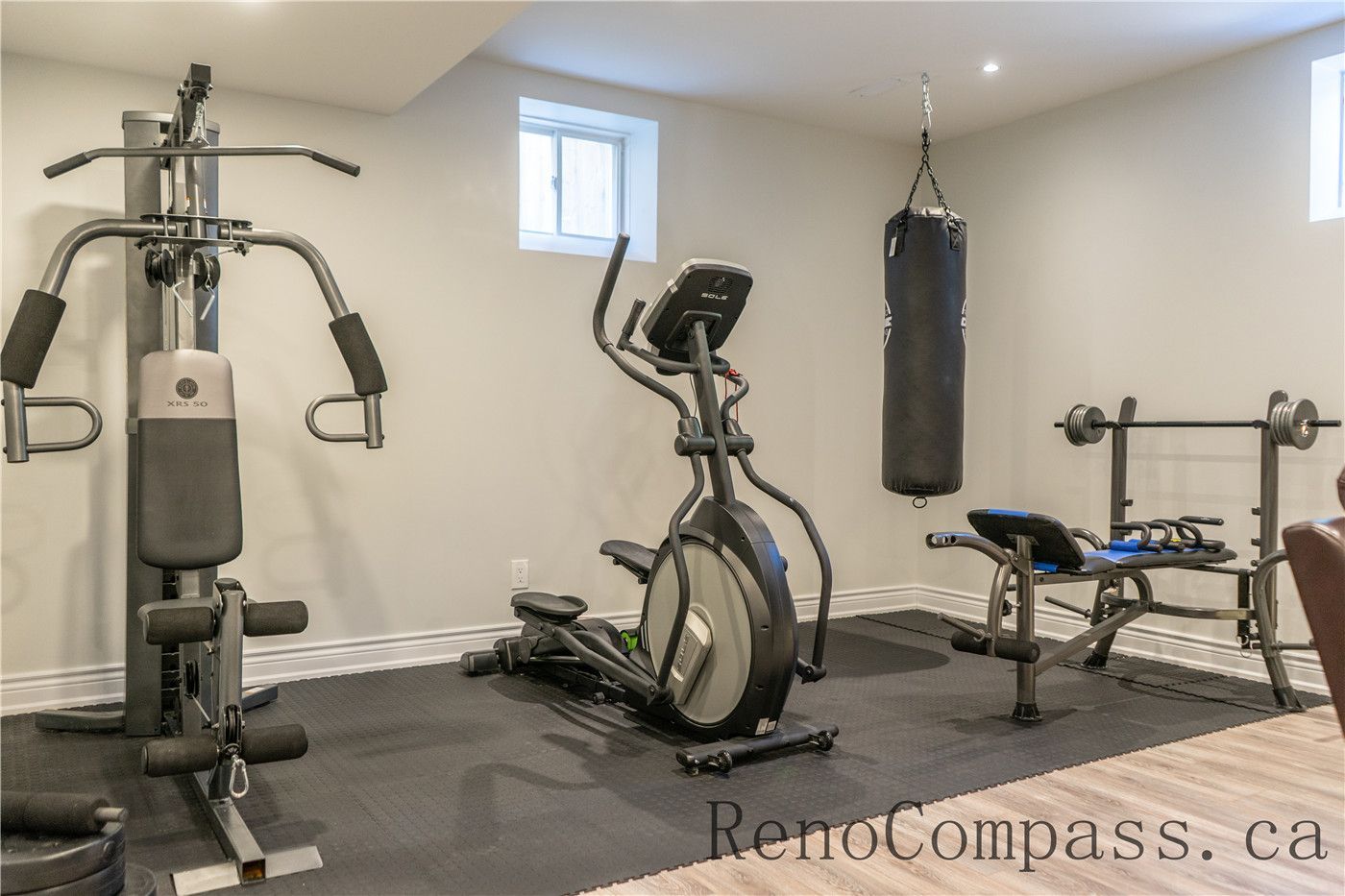 This Richmond Hill basement renovation includes a dedicated home gym with upgraded flooring, recessed lighting, and a functional open layout for fitness equipment. Designed for comfort and performance, the space adds lifestyle value to the home while showcasing the craftsmanship of a trusted Toronto renovation company specializing in full house and basement renovations.