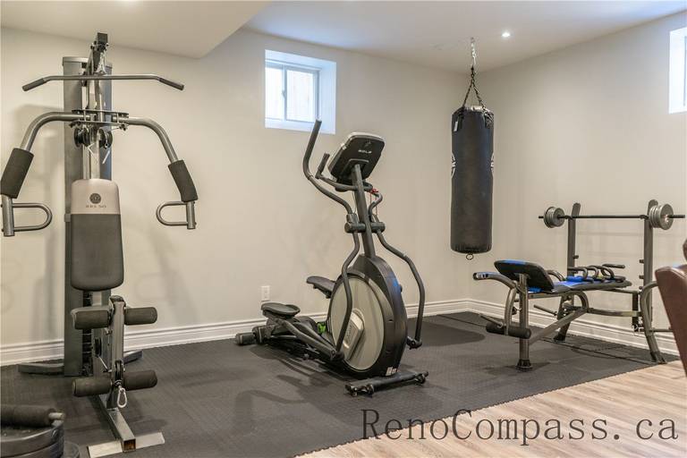 This Richmond Hill basement renovation includes a dedicated home gym with upgraded flooring, recessed lighting, and a functional open layout for fitness equipment. Designed for comfort and performance, the space adds lifestyle value to the home while showcasing the craftsmanship of a trusted Toronto renovation company specializing in full house and basement renovations.