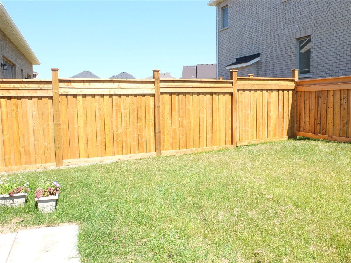 Newly installed wooden privacy fence for a detached home in Aurora. This backyard fence replacement project improves security, privacy, and overall curb appeal with durable pressure-treated wood panels and clean alignment. Completed by a professional Toronto Renovation Company.
