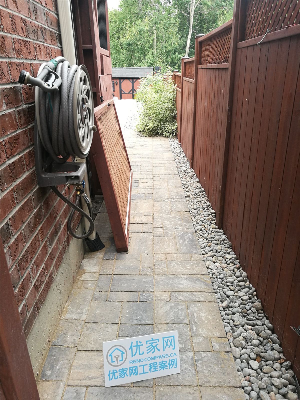 This image shows a side yard interlock walkway installation in Vaughan, featuring professionally laid paving stones and a clean gravel drainage strip along the fence line. The project improves accessibility, drainage, and overall outdoor functionality, providing a durable and low-maintenance solution for residential exterior spaces.
