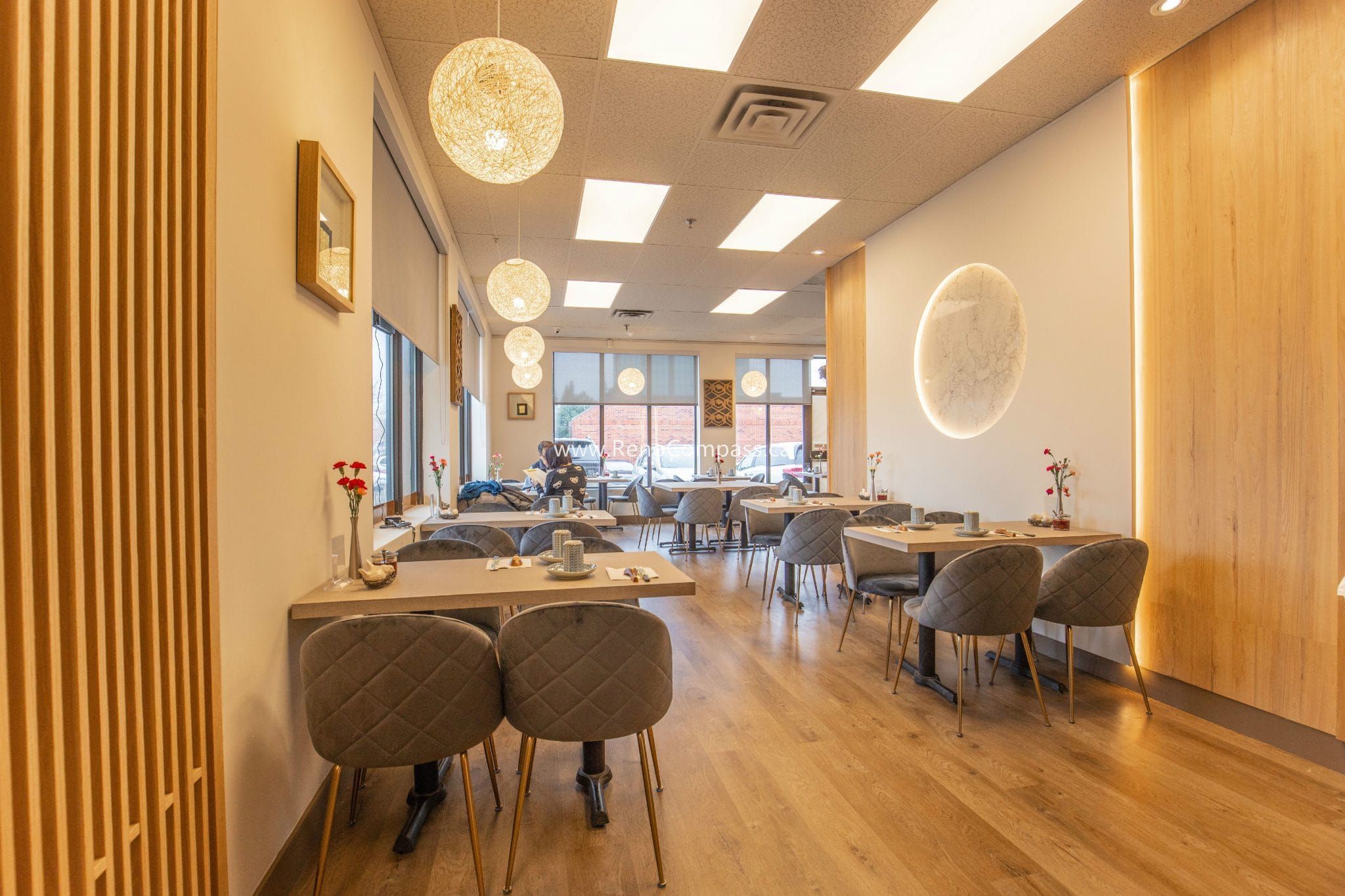 This Richmond Hill Chinese restaurant renovation completed by Toronto renovation company Reno Compass Inc. showcases a bright and modern dining space designed for comfort and efficiency. The upgraded interior features warm wood flooring, custom wall finishes, elegant pendant lighting, and contemporary seating arrangements that enhance the overall dining experience. With a carefully planned layout and refined aesthetic details, the renovation creates a welcoming atmosphere for guests while improving functionality and flow for daily restaurant operations.
