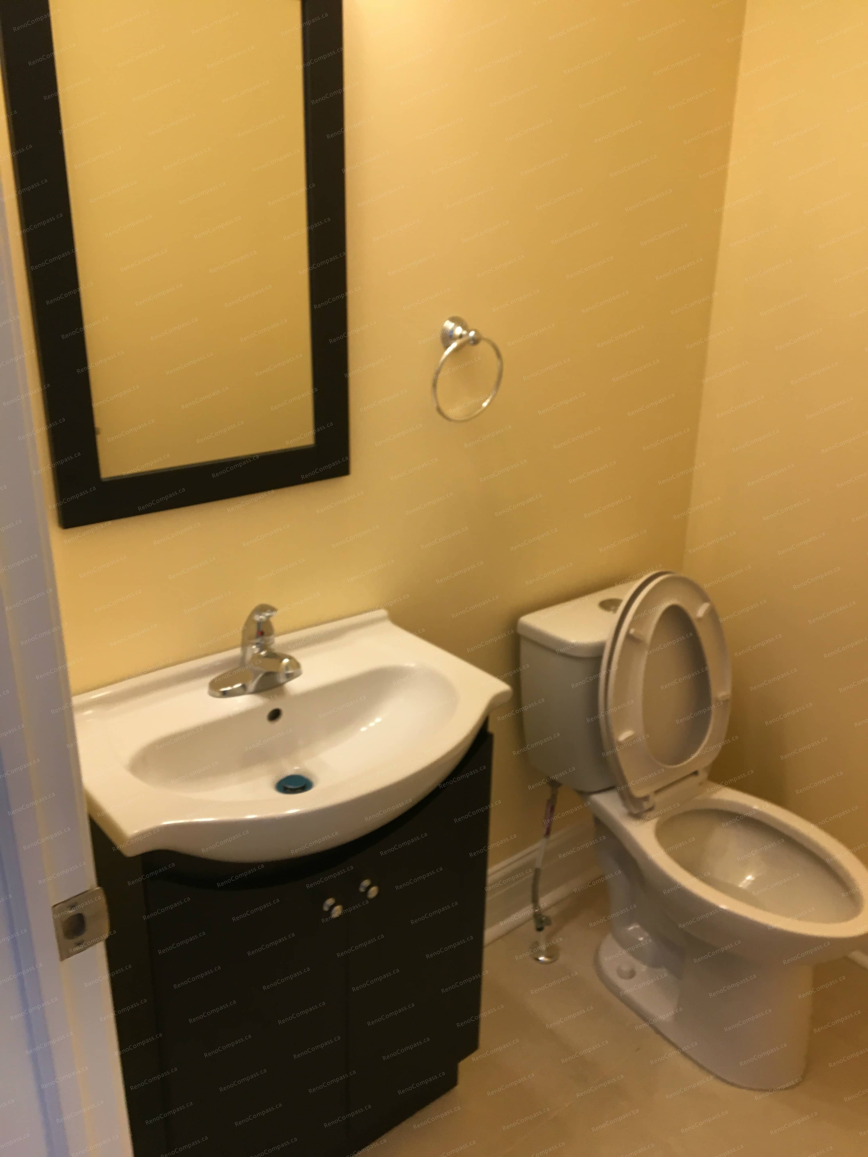 This Markham interior renovation features a clean and functional bathroom upgrade with a compact modern vanity, updated toilet installation, and fresh wall finishes. The improved layout enhances comfort and practicality while maintaining a simple, contemporary style. Completed by Reno Compass, a trusted Toronto renovation company specializing in bathroom and interior home renovations.