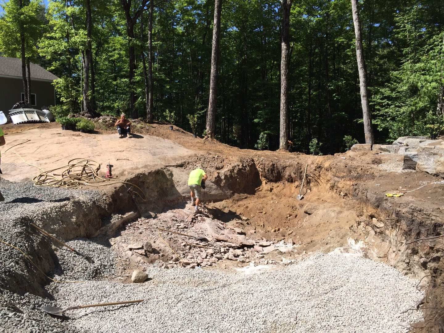 Professional swimming pool construction in Toronto featuring detailed excavation and ground preparation work. This stage includes site digging, gravel base installation, and structural groundwork to ensure a stable foundation for a long-lasting, high-quality residential swimming pool build by an experienced Toronto contractor.