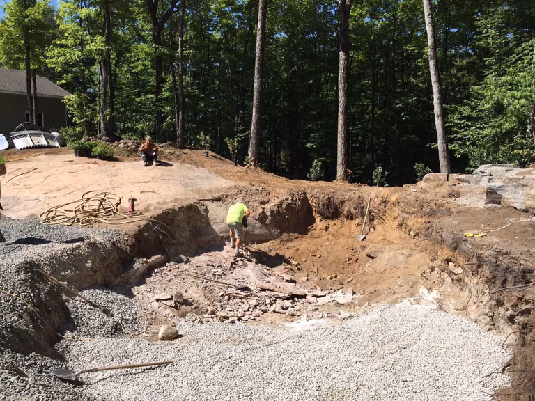 Professional swimming pool construction in Toronto featuring detailed excavation and ground preparation work. This stage includes site digging, gravel base installation, and structural groundwork to ensure a stable foundation for a long-lasting, high-quality residential swimming pool build by an experienced Toronto contractor.