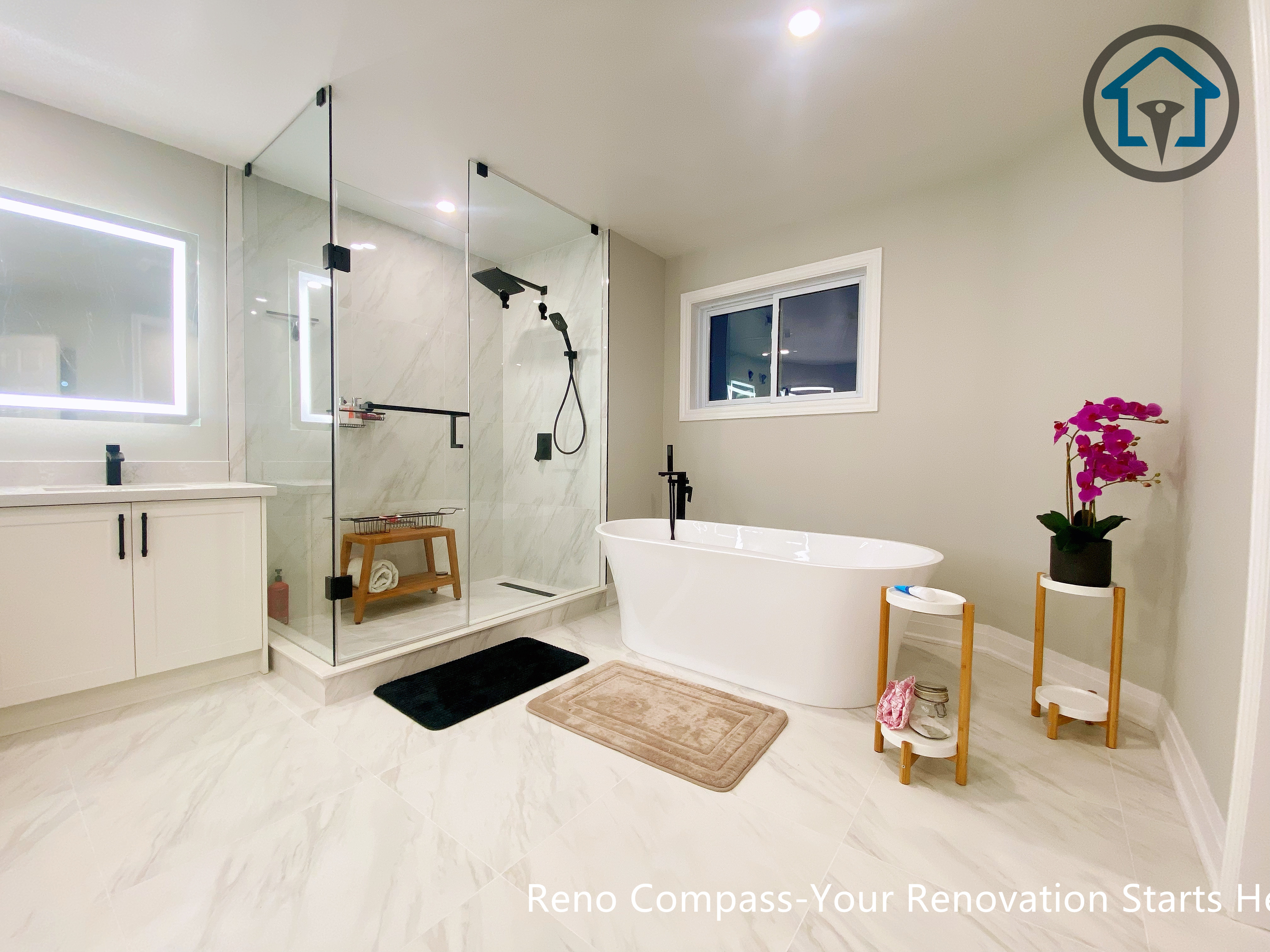 Bright and modern primary bathroom renovation in Newmarket featuring a clean layout, neutral tones, and improved accessibility designed for comfortable long-term living.