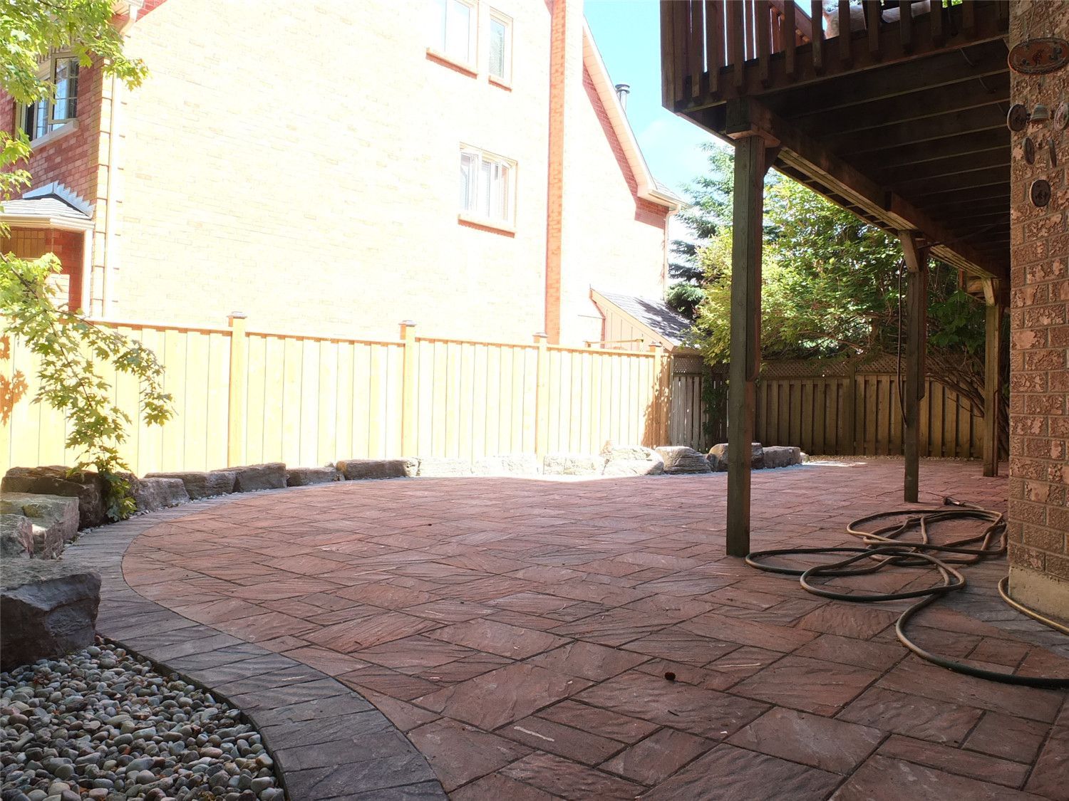 This Aurora interlocking and landscaping project by Reno Compass Inc. features a beautifully designed curved backyard patio with durable stone pavers, decorative borders, and a clean natural layout. The newly installed interlock surface enhances outdoor functionality, improves drainage, and creates a welcoming space for relaxation and entertaining.

Expertly planned and installed, this backyard renovation blends structure with nature, delivering a long-lasting and visually appealing outdoor living environment for the homeowner.