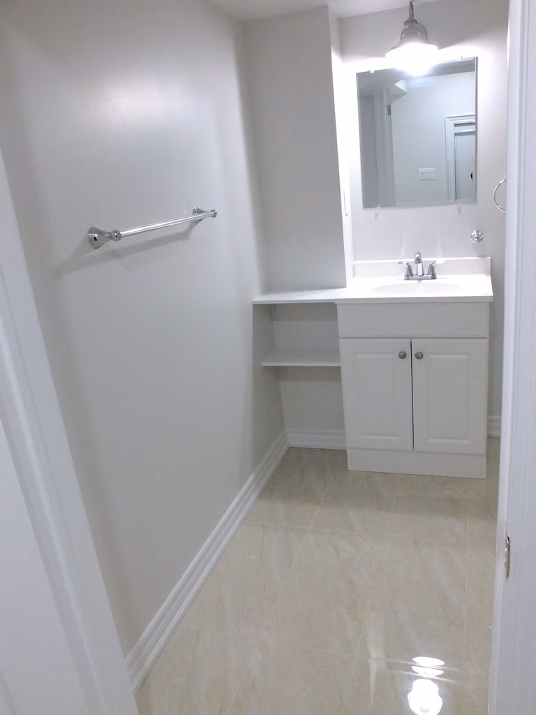 This image presents the completed basement living area after renovation in Richmond Hill. The improved layout, light finishes, and durable flooring create a flexible space suitable for family use, a home office, or guest accommodation. The project was delivered by an experienced Toronto renovation company focused on long-term value.