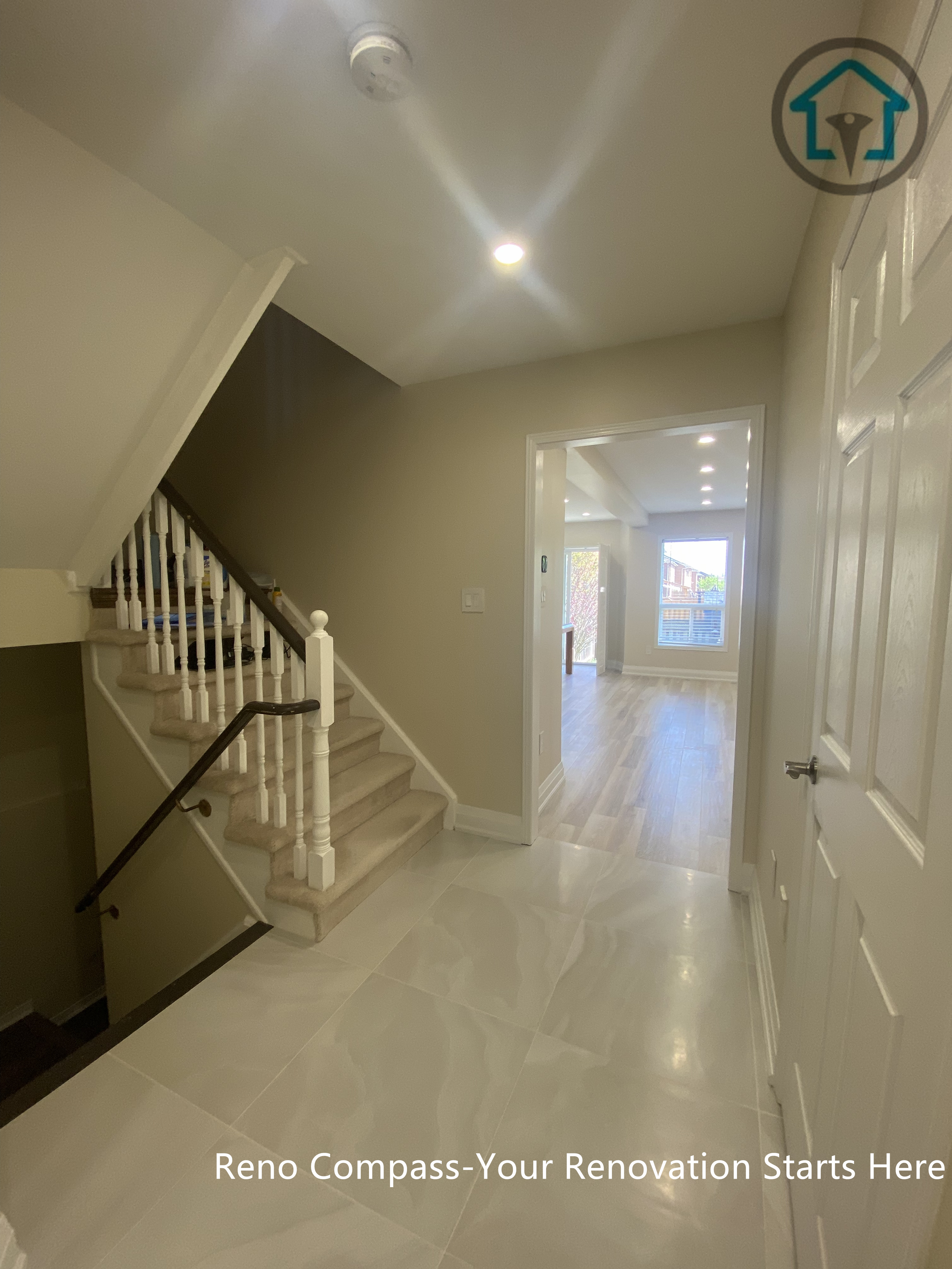 Hallway and staircase area from a completed interior renovation project in Vaughan, featuring a clean layout and smooth circulation by Reno Compass.