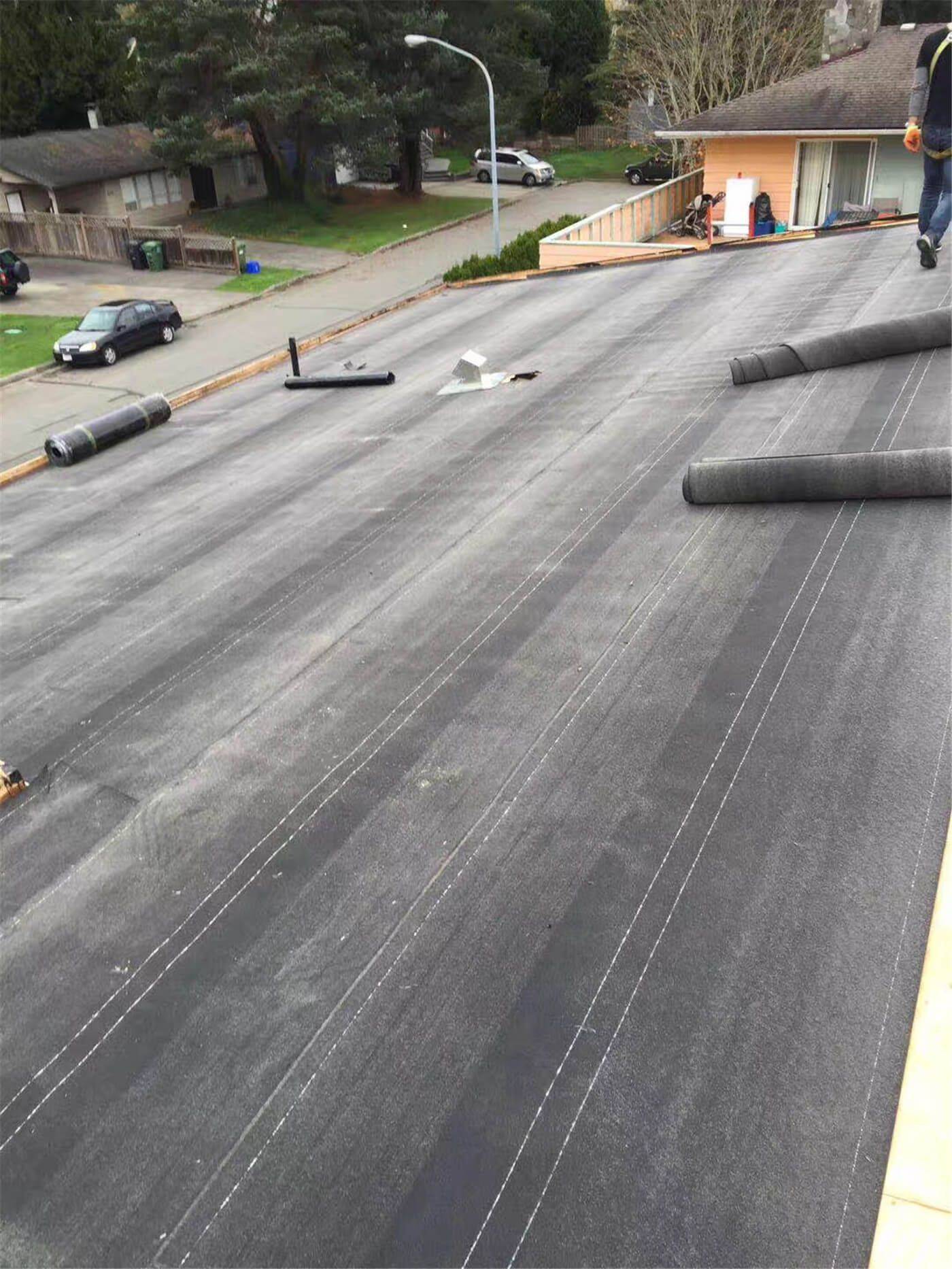 New asphalt shingle roof installation in Toronto, showing precise shingle alignment, proper underlayment coverage, and clean roof edge detailing. The roofing system includes upgraded flashing and vent pipe installation to ensure effective water drainage, ventilation, and long-term weather resistance. This roof replacement improves both durability and curb appeal while meeting Toronto building code standards.