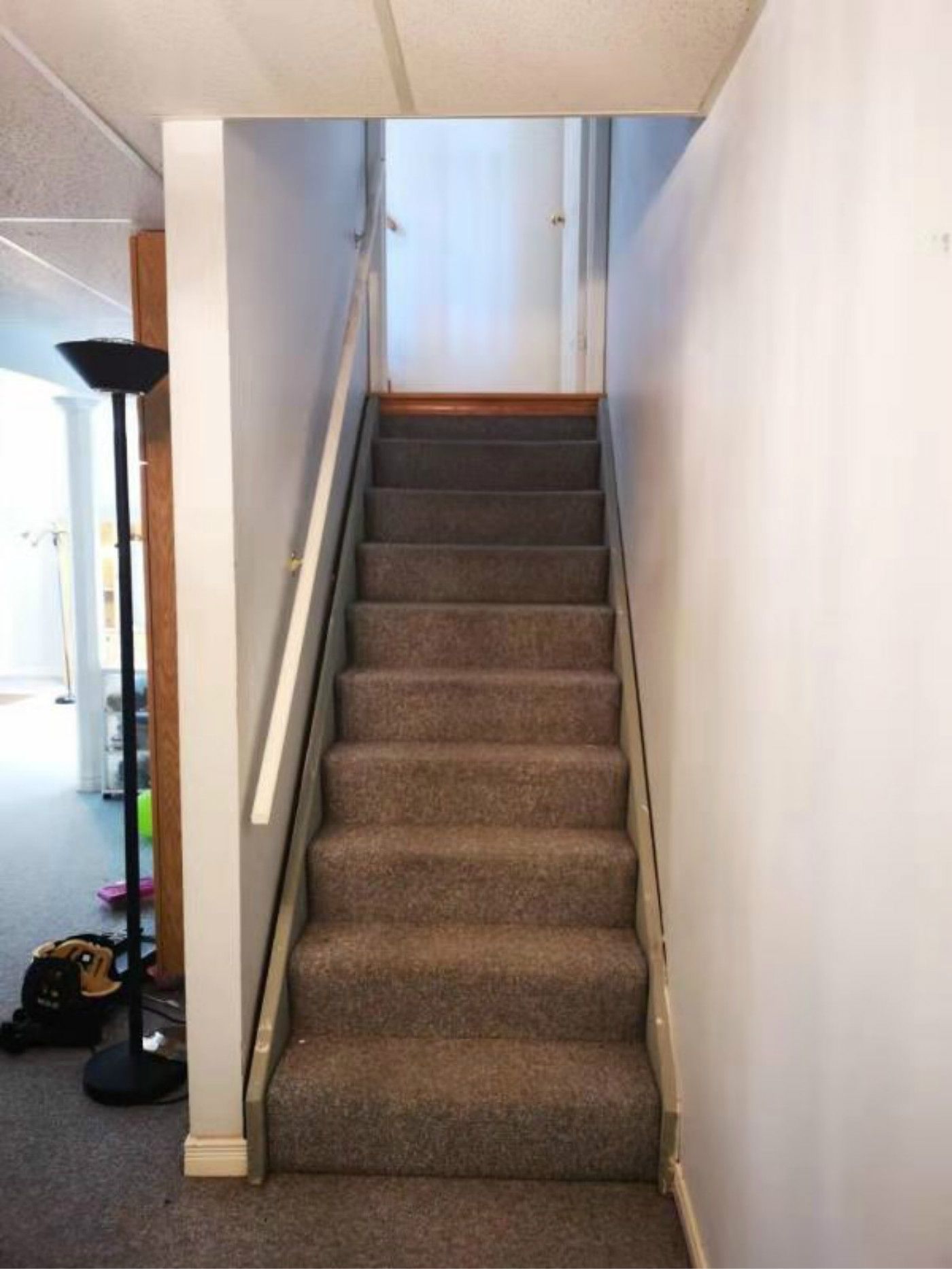 This Mississauga basement staircase features carpeted steps, simple handrails, and a narrow layout leading to the upper level. The existing design highlights opportunities for modern railing upgrades, improved lighting, and enhanced safety. A professional Toronto renovation company can transform this staircase into a more stylish and durable transition space.