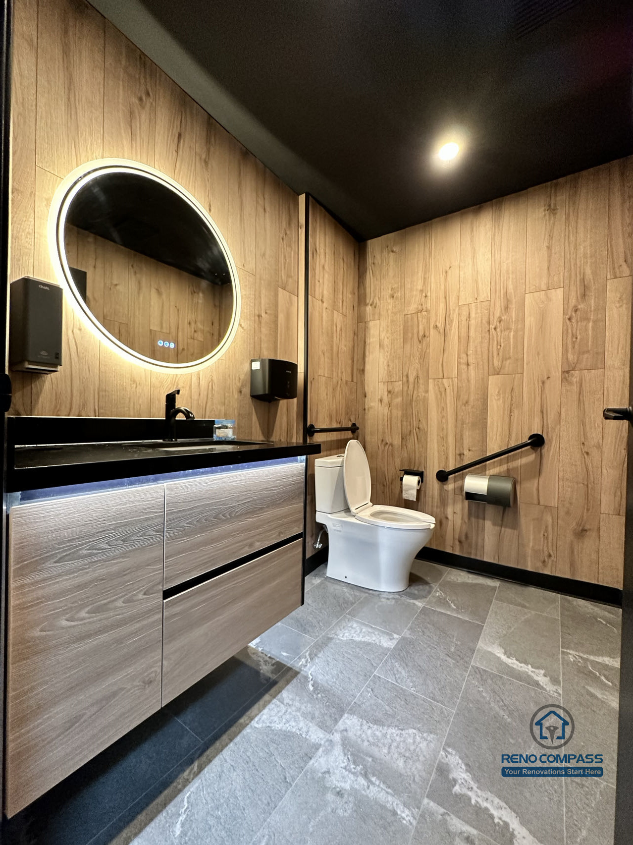 This Mississauga restaurant renovation includes a modern commercial washroom with durable finishes, custom vanity cabinetry, and integrated lighting. The design focuses on easy maintenance, long-term durability, and a clean, professional appearance suitable for high-traffic restaurant use.