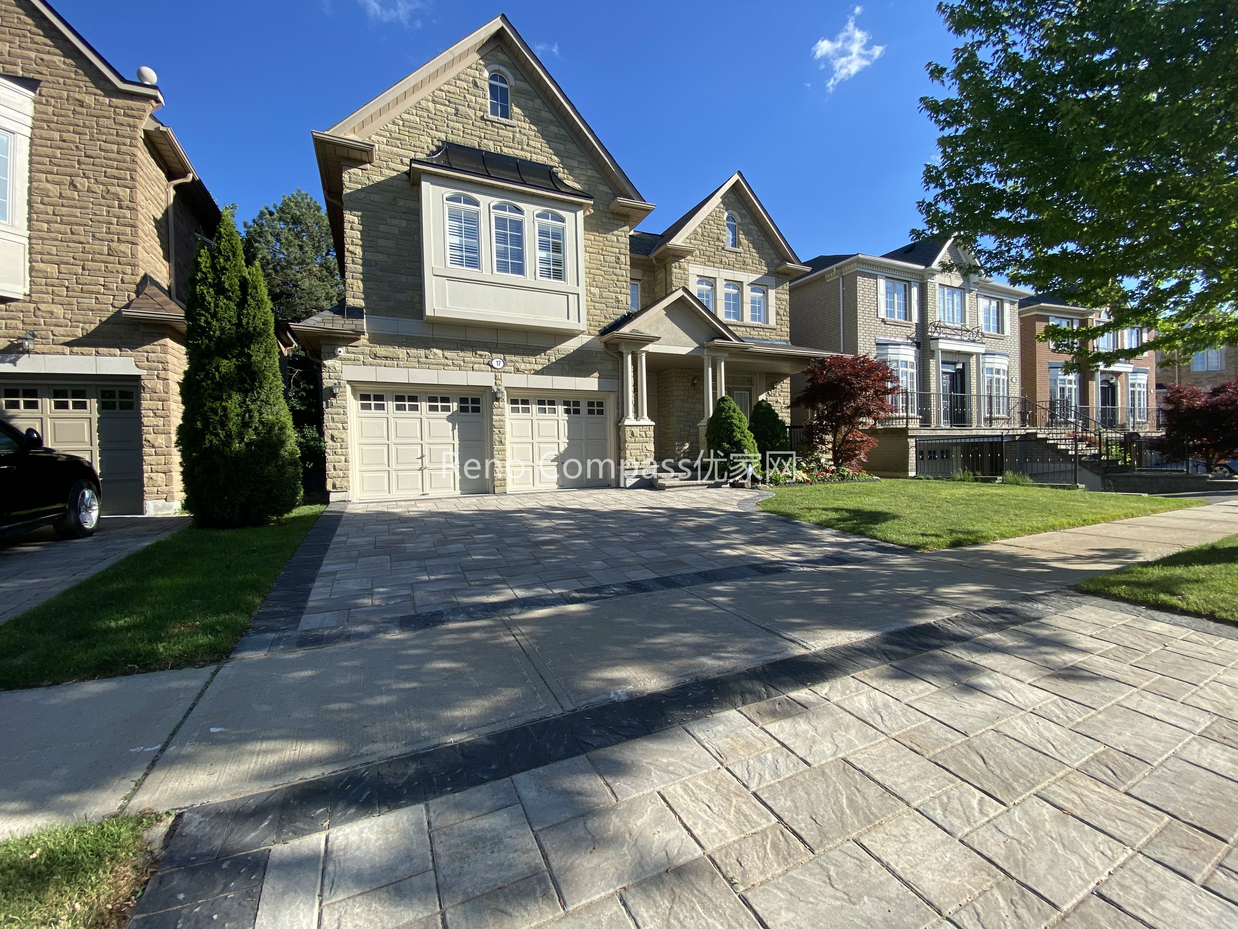 This image showcases a completed driveway interlocking project in North York, featuring natural stone pavers with a structured layout and clean border detailing. The interlocking driveway is designed to provide long-term durability, proper drainage, and a refined curb appeal that complements the home’s stone façade. Precise alignment and material selection ensure a balanced appearance while supporting daily vehicle use. Completed by a Toronto landscaping and interlocking contractor, this North York driveway renovation highlights quality craftsmanship, structural stability, and a practical approach to residential outdoor paving.
