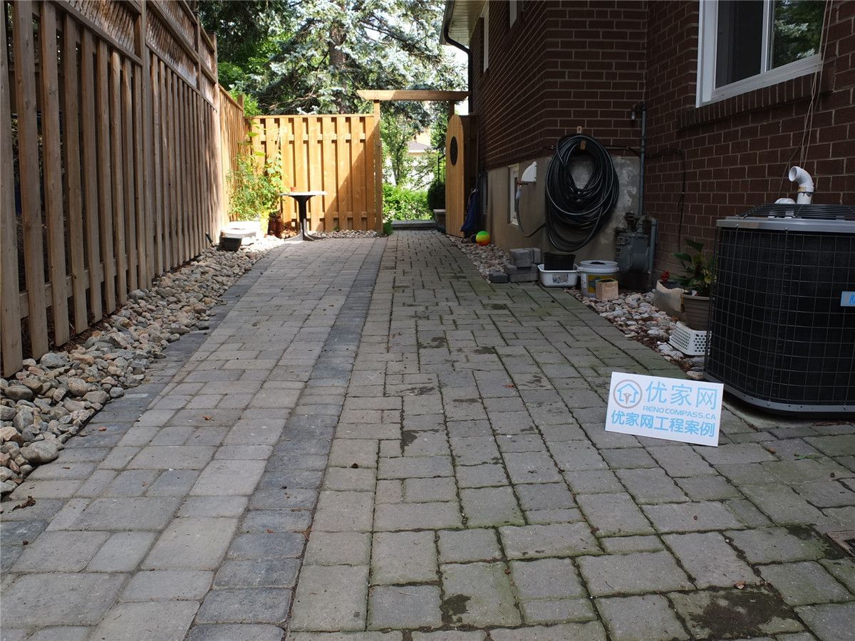 This image shows the existing interlock walkway and side yard area in a North York landscaping renovation project. The original pavers, edging, and drainage conditions were evaluated to determine necessary upgrades before new interlocking work. Proper assessment of side yard access paths is essential to improve durability, water flow, and overall functionality in landscaping renovations.