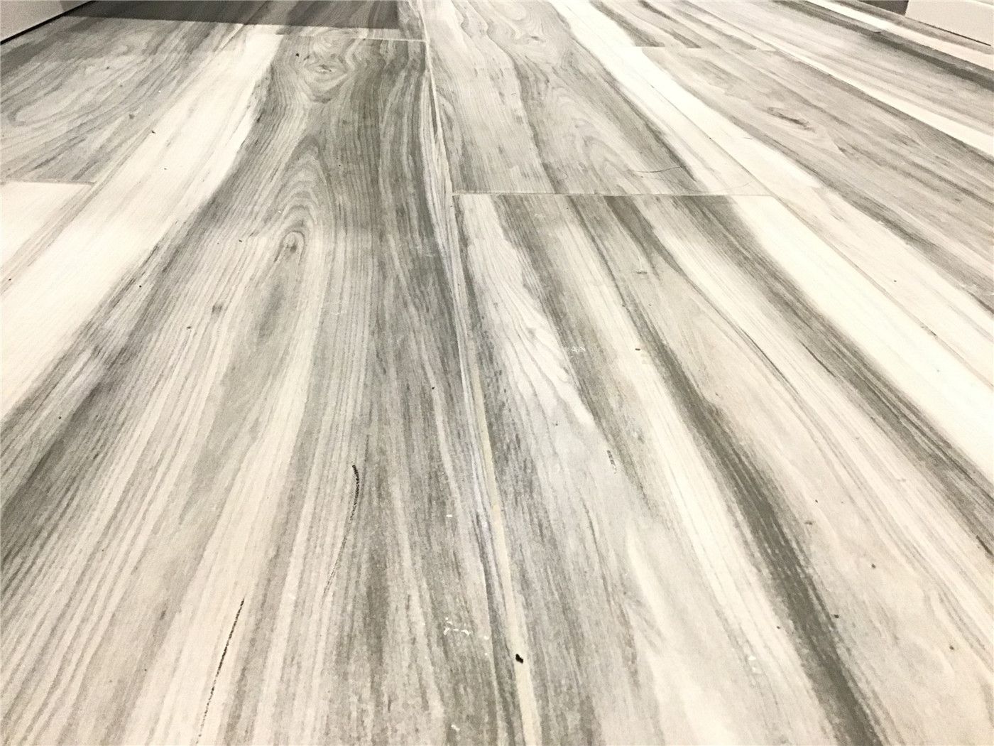 This Richmond Hill basement renovation features durable wood-look vinyl plank flooring with natural grain texture and modern grey tones. The flooring provides a waterproof and low-maintenance solution, making it ideal for basement spaces while maintaining a stylish hardwood appearance. A popular choice for basement finishing projects in Richmond Hill.