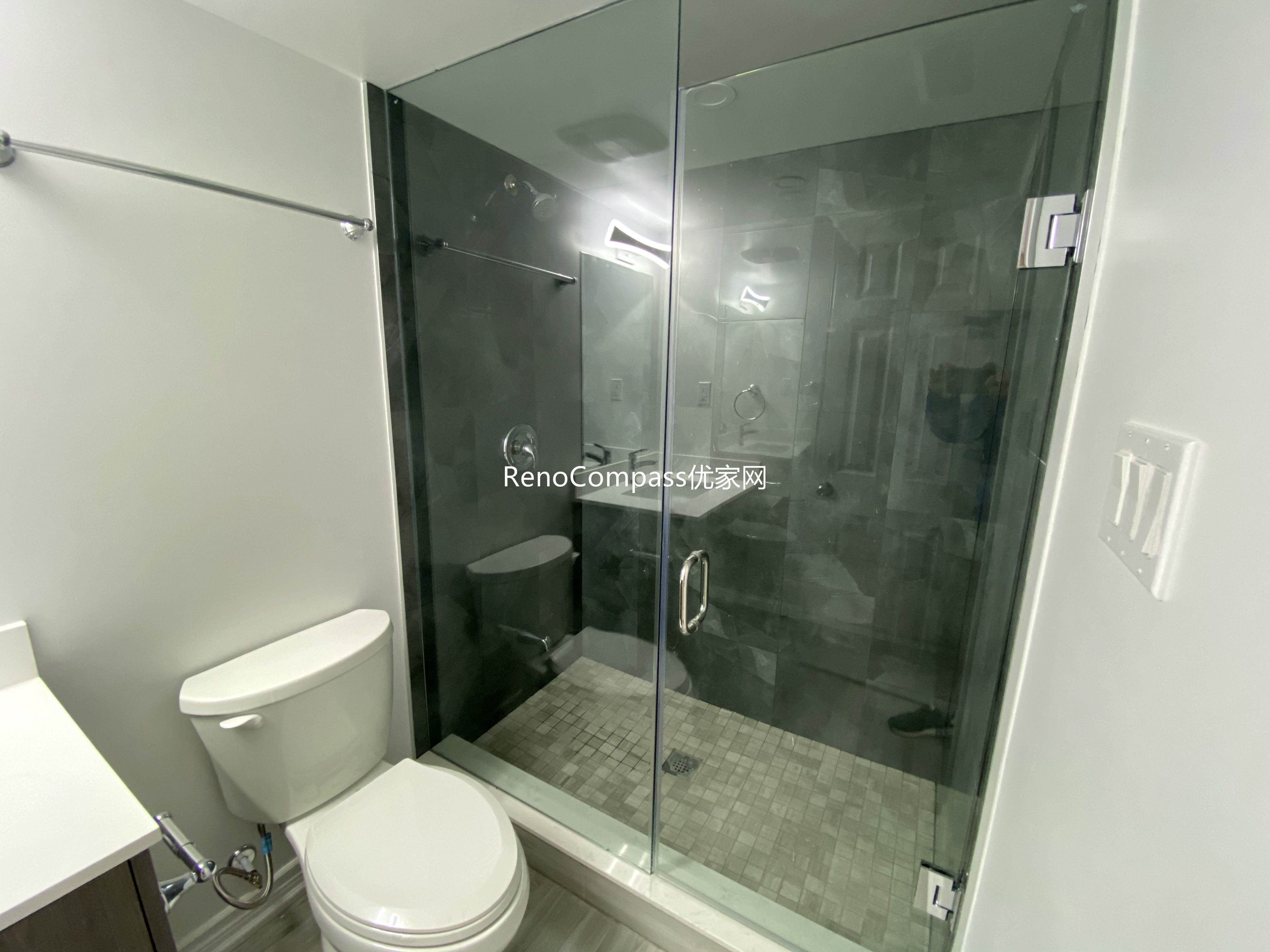 Basement bathroom renovation in Richmond Hill featuring a modern glass shower enclosure, upgraded tile flooring, and clean contemporary fixtures. Completed by a professional Toronto renovation company, this finished basement bathroom offers improved functionality, durability, and a sleek modern design for everyday comfort and convenience.