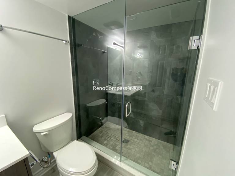Basement bathroom renovation in Richmond Hill featuring a modern glass shower enclosure, upgraded tile flooring, and clean contemporary fixtures. Completed by a professional Toronto renovation company, this finished basement bathroom offers improved functionality, durability, and a sleek modern design for everyday comfort and convenience.
