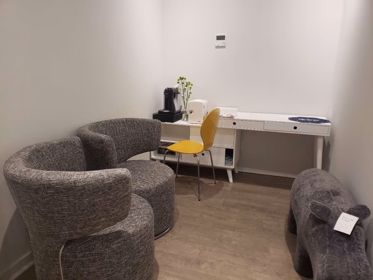 This image features a private consultation and waiting area within a modern beauty and massage spa, completed by a trusted Toronto renovation company specializing in commercial interior renovations. The space is designed with comfortable seating, warm wood flooring, and a clean workstation layout to create a calm and welcoming environment for client consultations and relaxation. Neutral wall tones and soft lighting enhance the tranquil spa atmosphere while maintaining functionality for daily operations. This type of layout is ideal for beauty clinics, wellness studios, and massage therapy centers across Toronto and the GTA seeking a professional and relaxing interior upgrade.