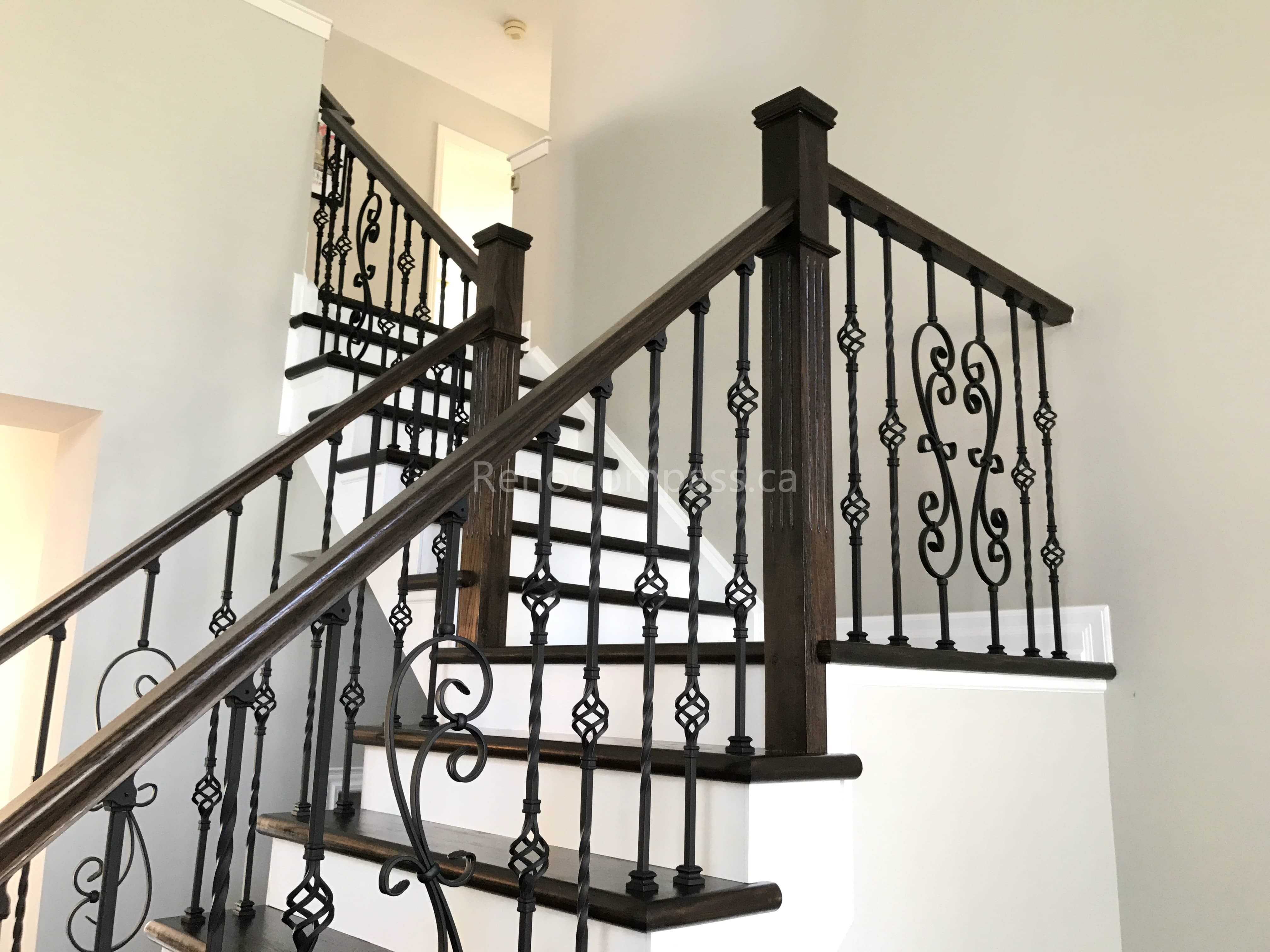 This Markham home renovation features a beautifully upgraded hardwood staircase with dark wood stair treads and elegant wrought iron railings. The contrast between the rich flooring and bright risers creates a clean, modern, and sophisticated visual impact. Completed by a trusted Toronto renovation company, this staircase upgrade enhances both safety and interior aesthetics while maintaining a cohesive flooring design throughout the home.