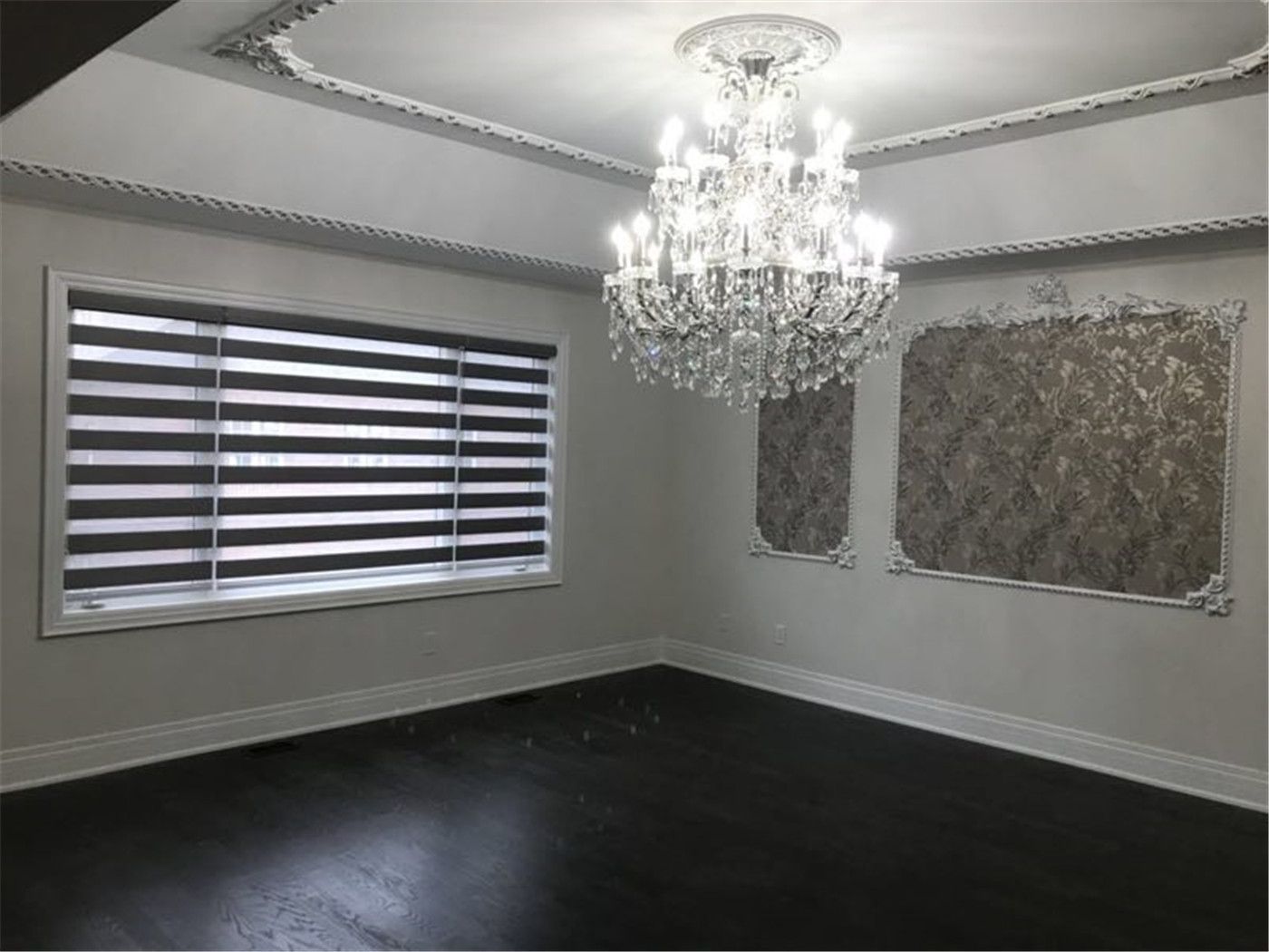 Modern zebra blinds installed in a Toronto home, featuring dual-layer fabric for adjustable light control and privacy. The clean horizontal design complements the elegant interior and enhances the overall modern aesthetic.