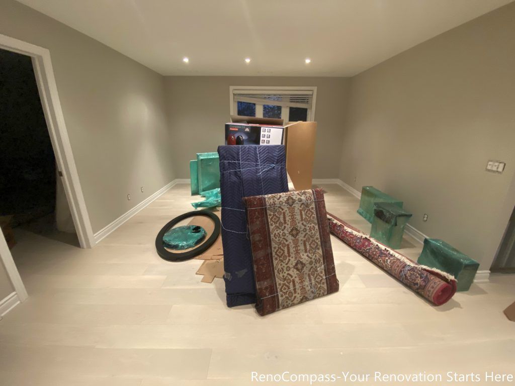 This completed interior renovation features light wood flooring, smooth neutral wall finishes, and evenly spaced recessed ceiling lights that enhance the overall brightness of the space. The open layout allows flexibility for furniture arrangement while maintaining clean sightlines and balanced proportions. Designed and completed by Reno Compass, this renovation focuses on long-term functionality, comfort, and a timeless interior foundation suitable for everyday living.